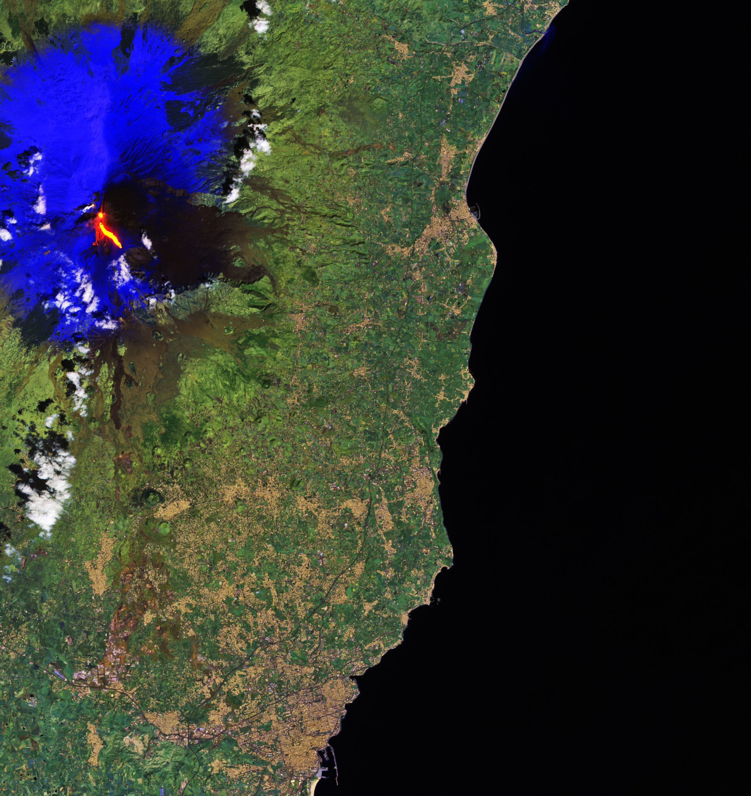 An image of erupting Mount Etna taken on March 16th by the European Space Agency. The surrounding snow has been processed in blue to distinguish from the clouds.