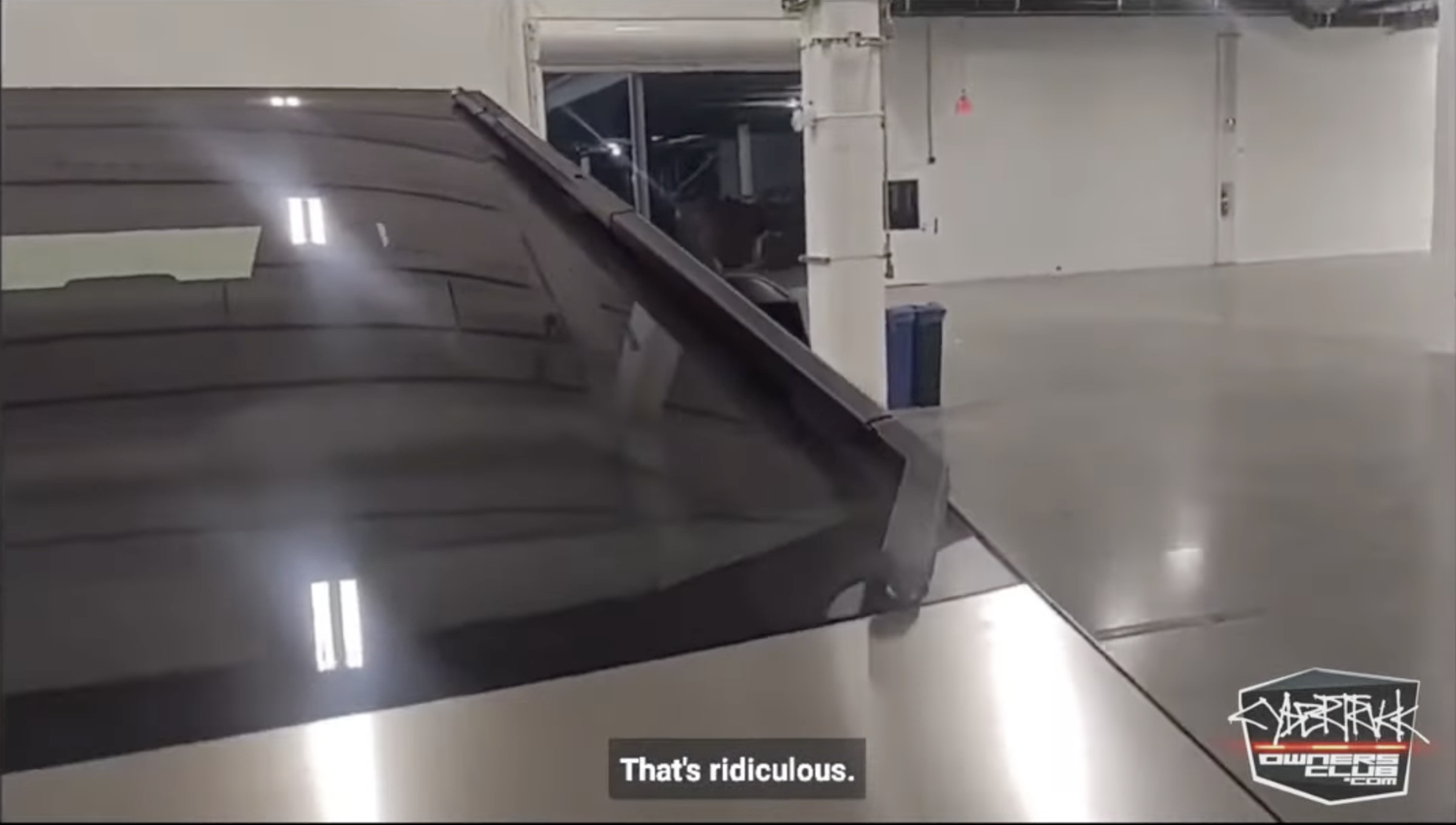 The person in the video seems to express doubt that it can clean the entire windshield but is assured it can.