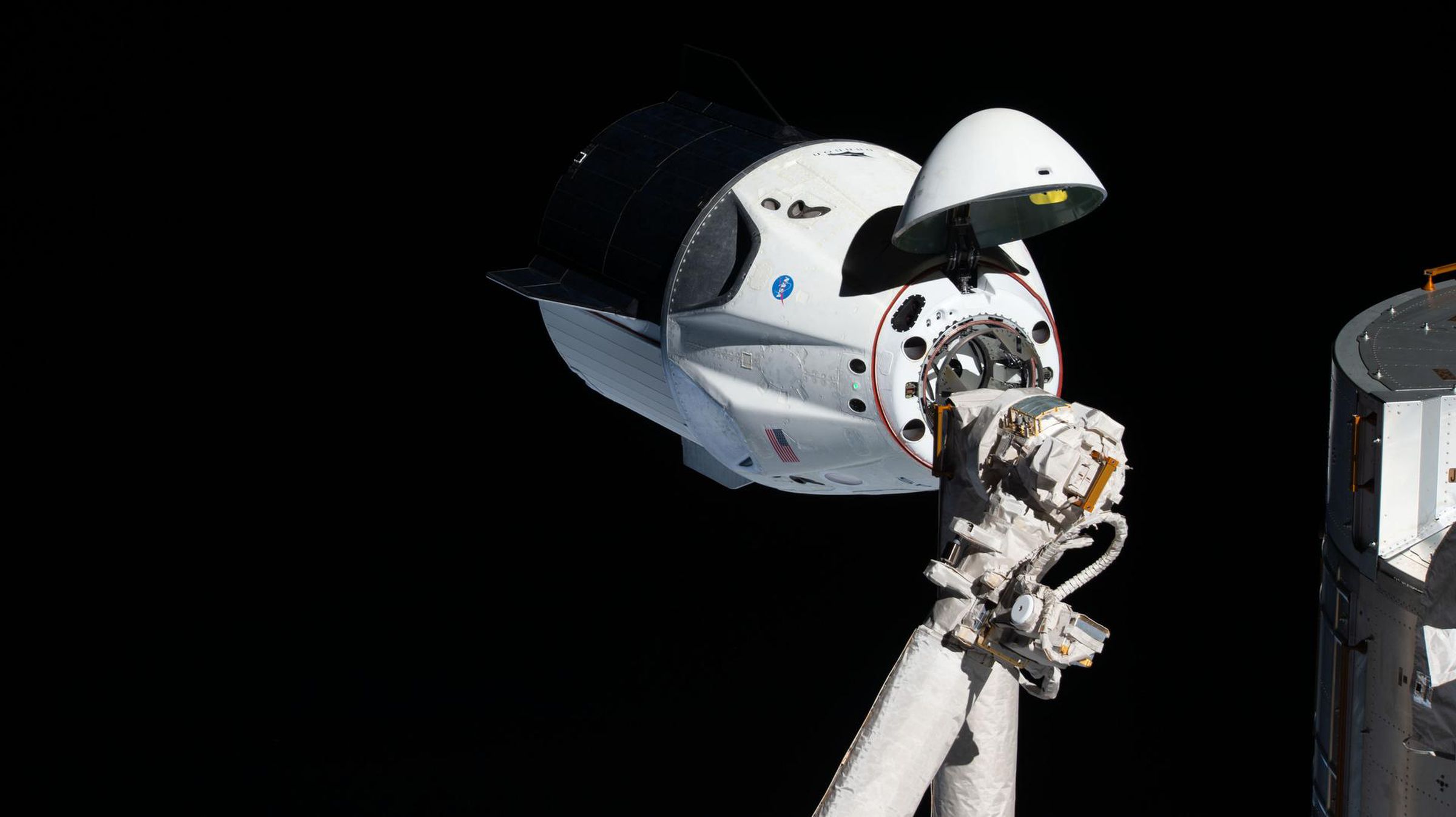 SpaceX’s uncrewed Crew Dragon in space, just before docking with the ISS