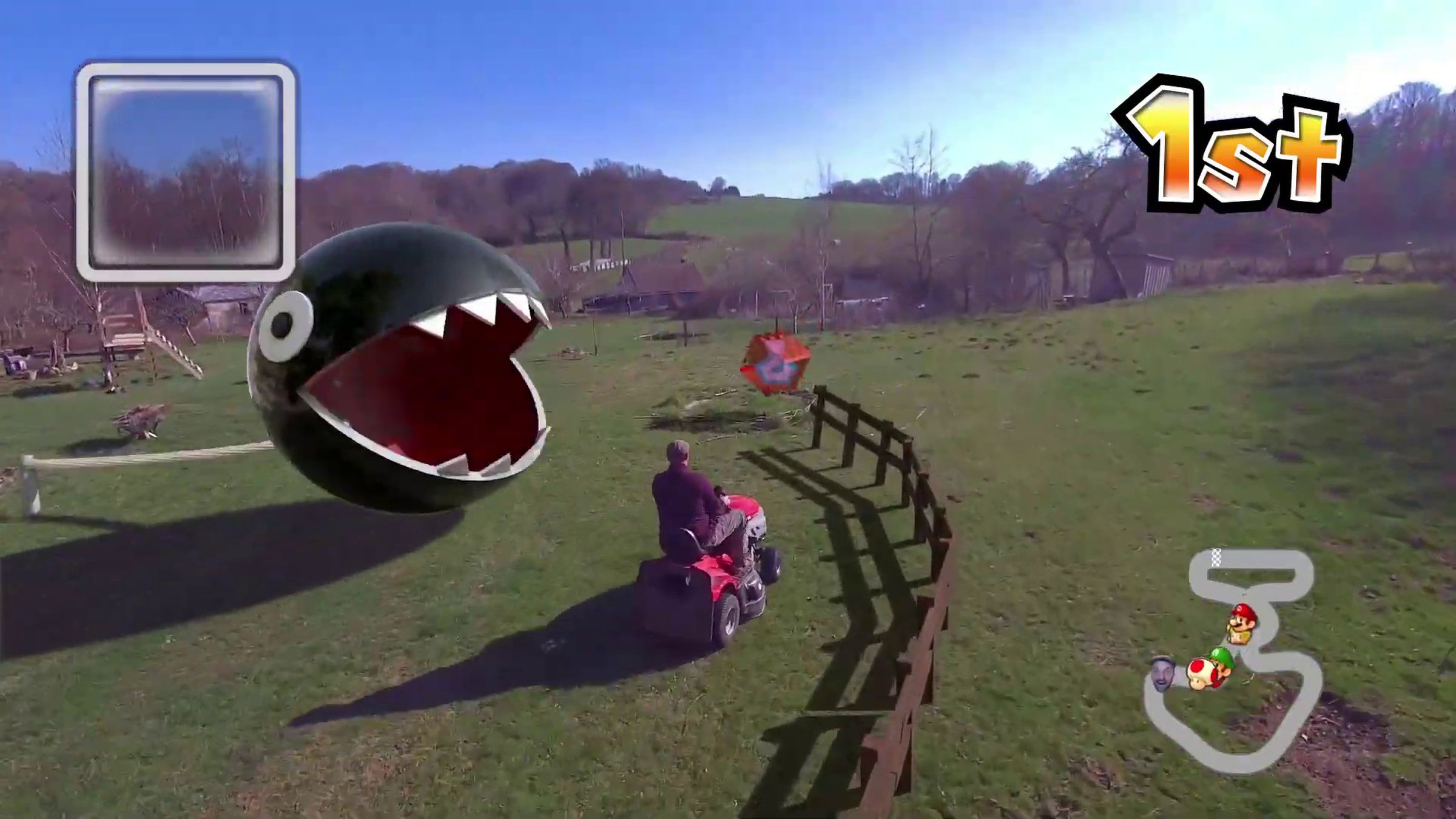 Mario Kart in real life thanks to CG and a self-flying drone: a chain chomp appears to be attacking this riding lawnmower.