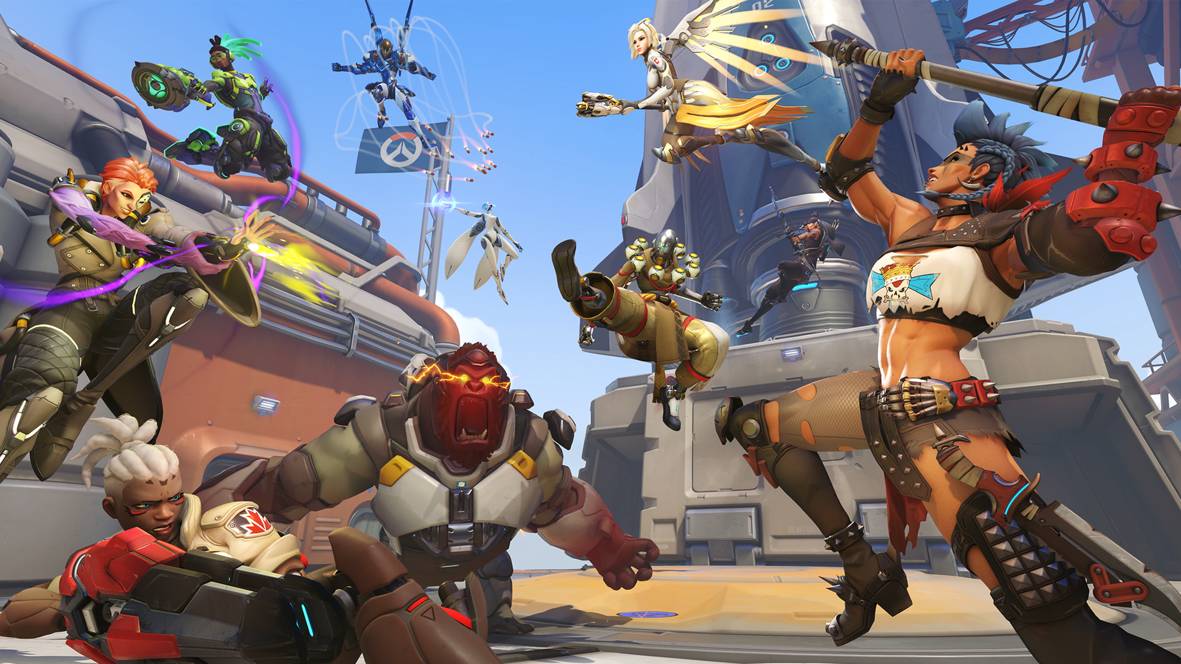 Promotional graphic for Overwatch 2 featuring a screen full of the different heroes battling in two teams of five