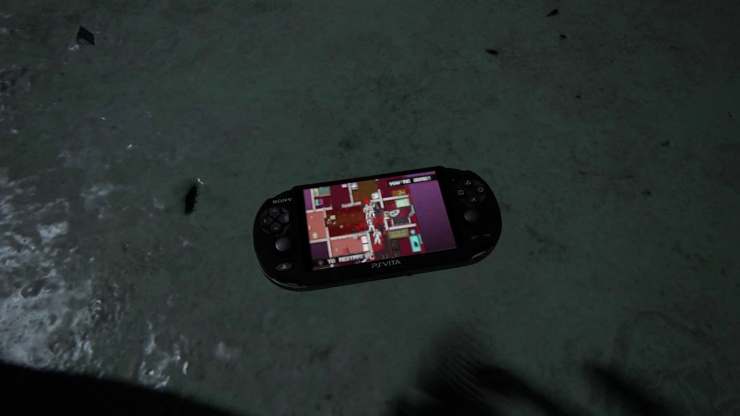 A screenshot of Hotline Miami running on a PlayStation Vita in The Last of Us.
