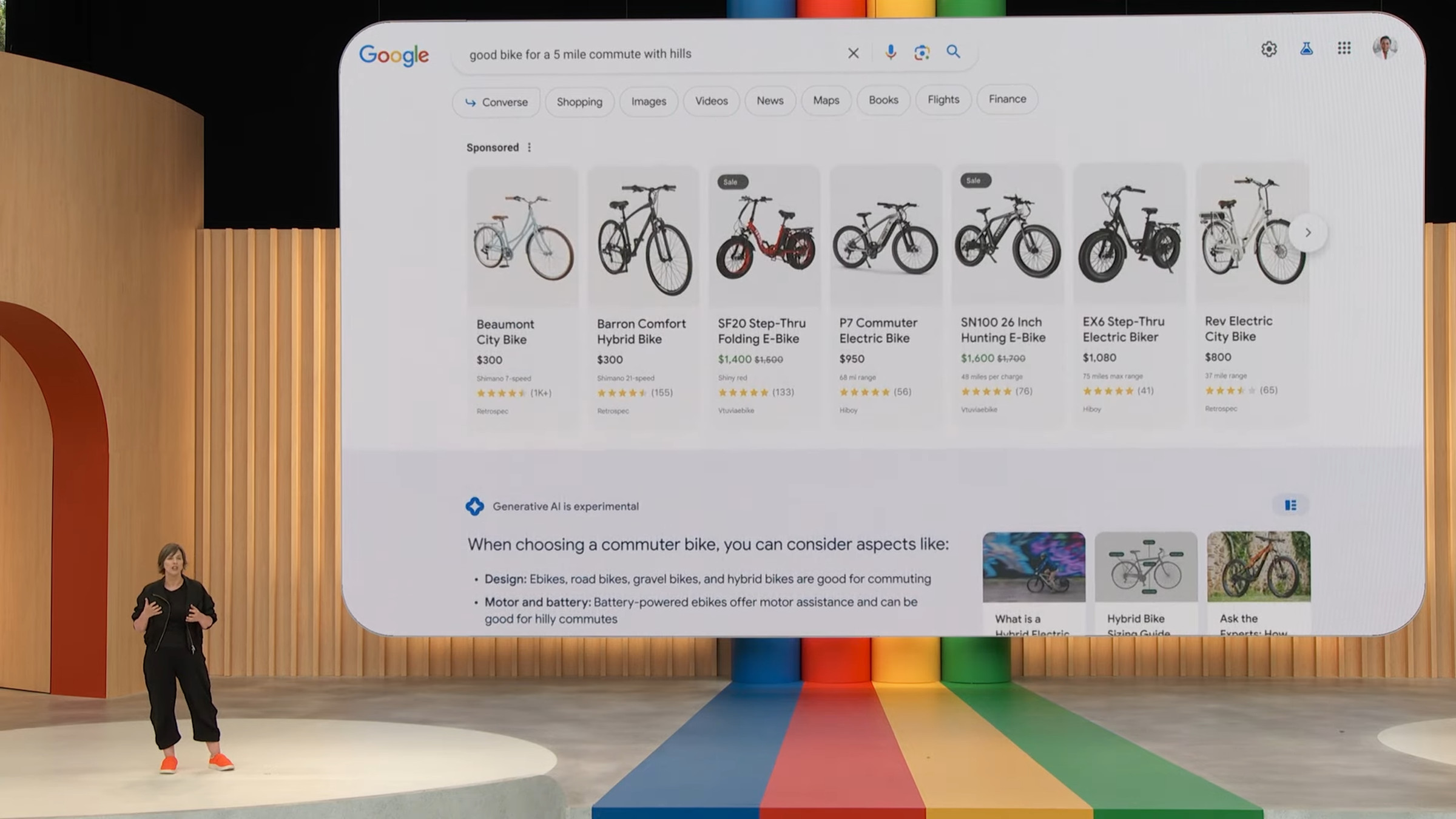 Google’s Cathy Edwards in front of a screenshot of Google’s Search Generative Experience showing ads.