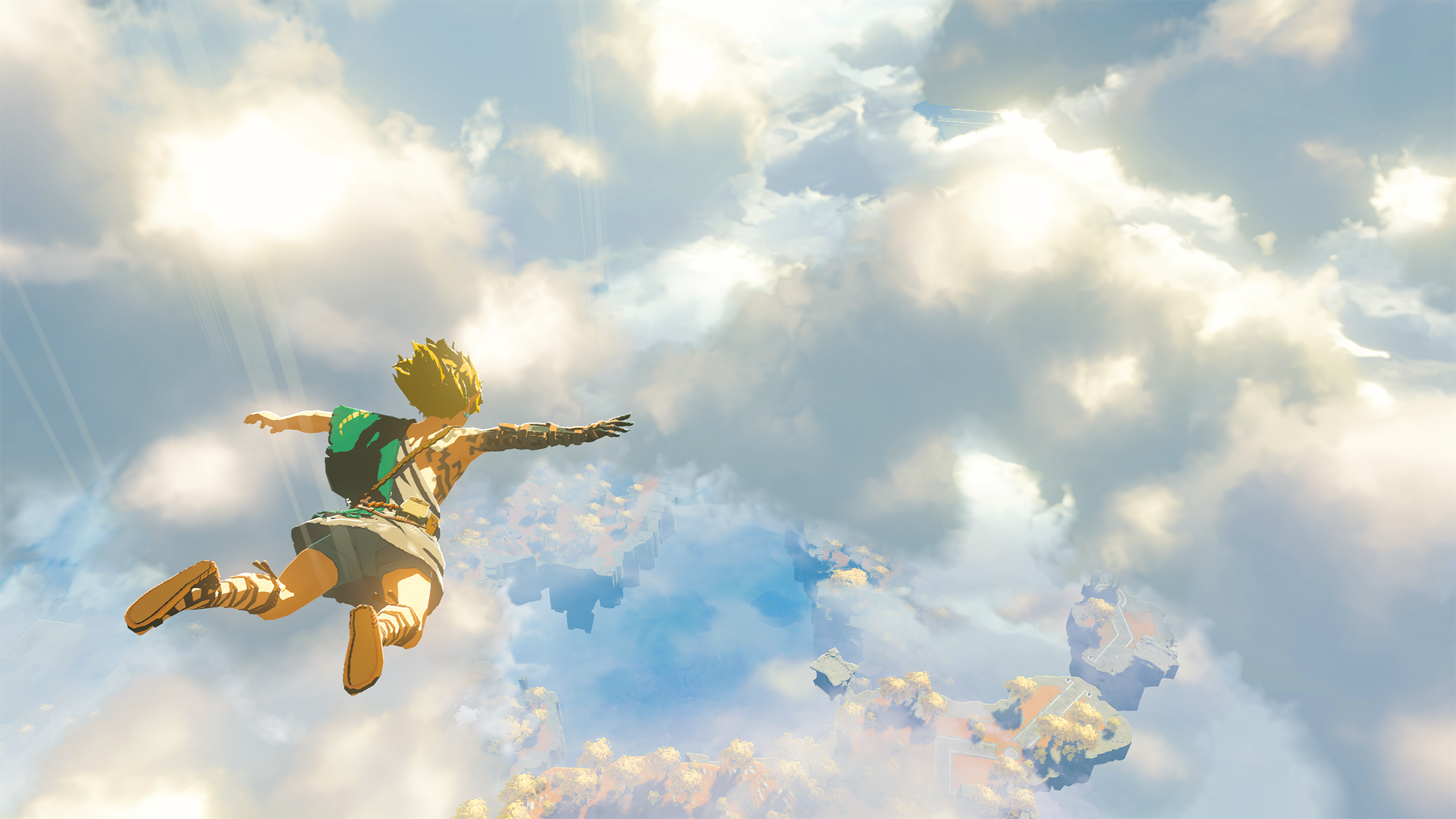 Screenshot from Tears of the Kingdom featuring Link in free fall descending from the Sky Islands to Hyrule below.