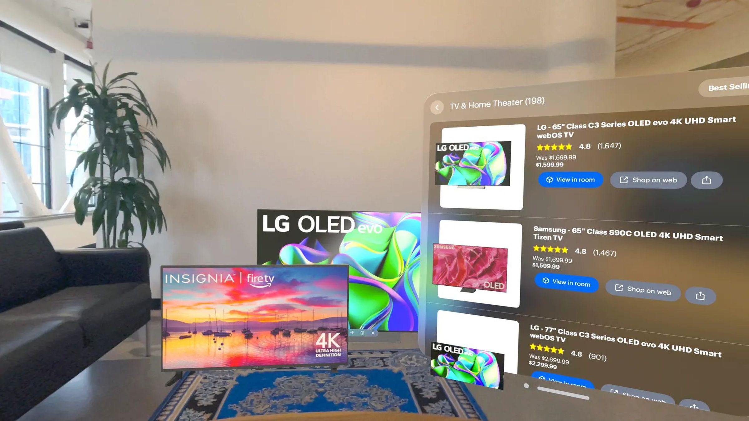 Simulated view of the Best Buy Vision Pro app projecting LG and Amazon TVs into a living room setting next to a page of Best Buy product listings with details and prices.