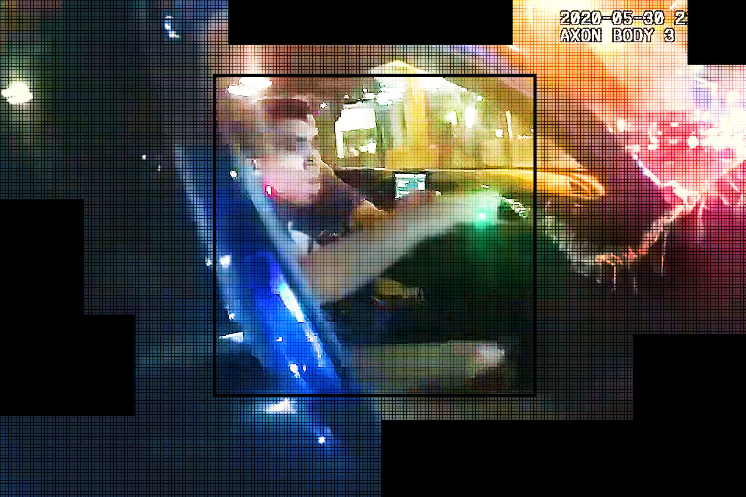 In a still from a police body camera videoclip, we see a man being pulled from a car.