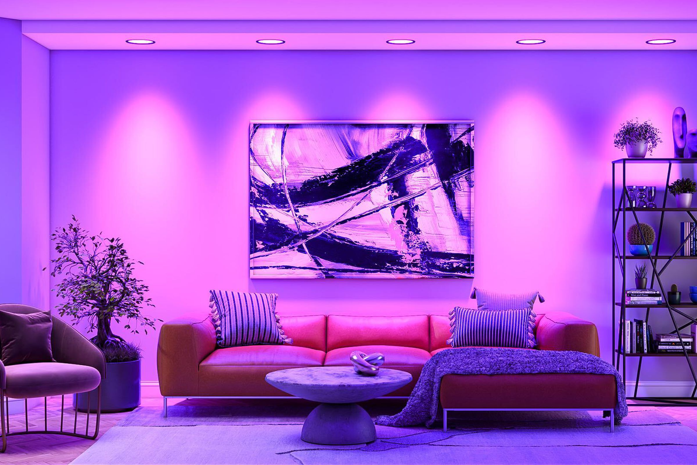 A living room with purple downlighting.