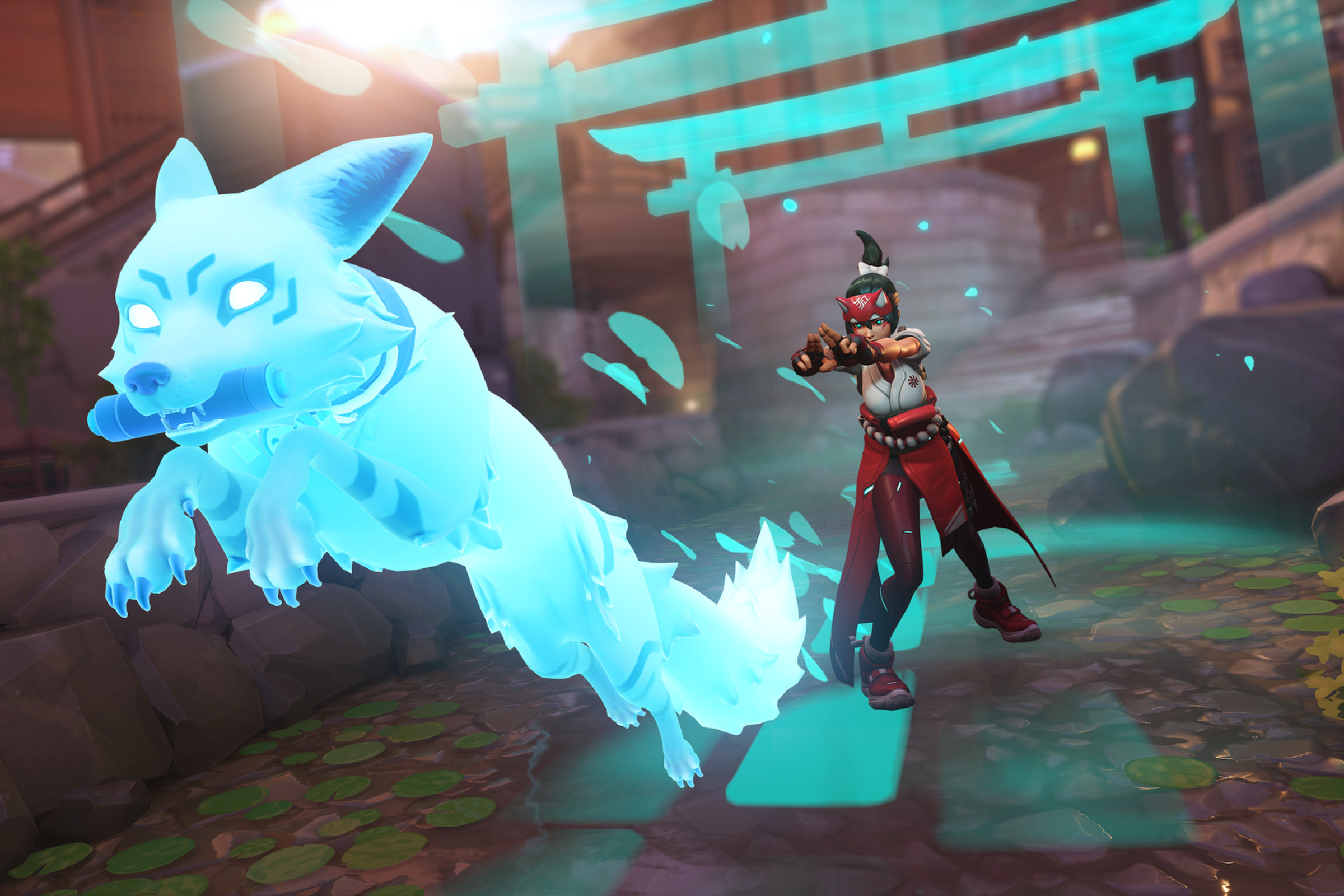 Screenshot from Overwatch 2 featuring the new hero Kiriko, a Japanese ninja clad in a red and white shrine maiden outfit modified to look like contemporary streetwear sending forth her spectral blue colored fox spirit