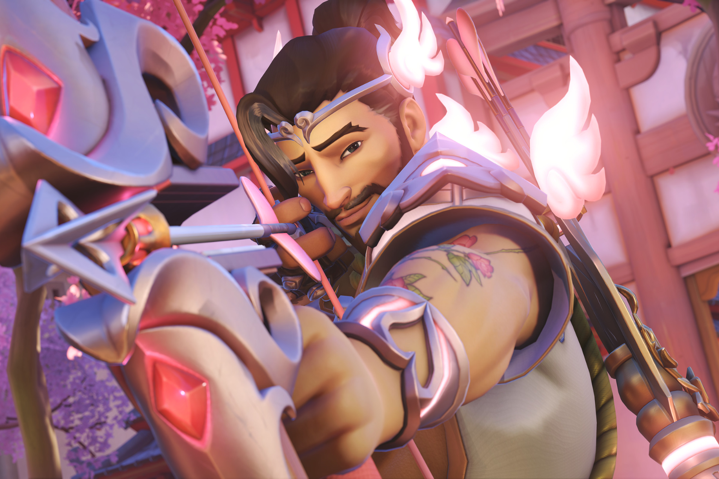 Image of Overwatch hero Hanzo dressed as cupid firing an arrow at the screen.