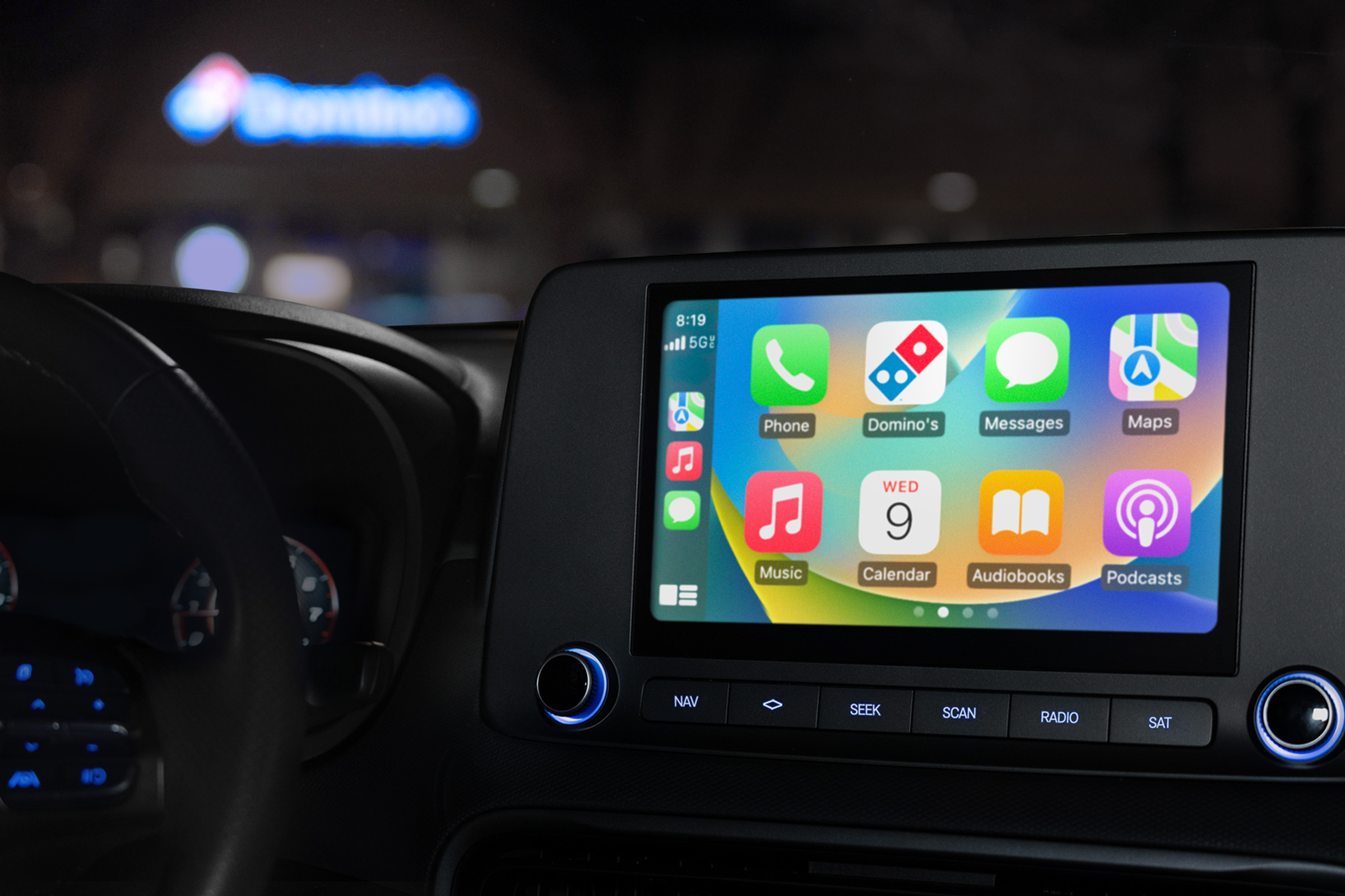 CarPlay screen in a car with the domino’s app in the grid