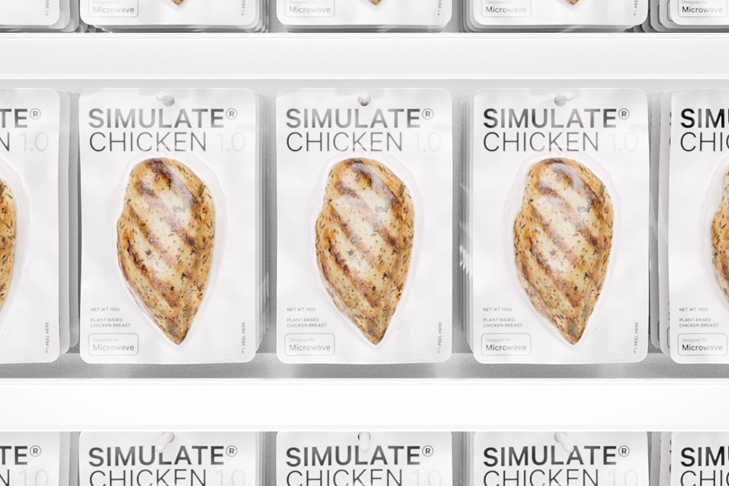 Rows of individually wrapped chicken breasts hanging on a store display