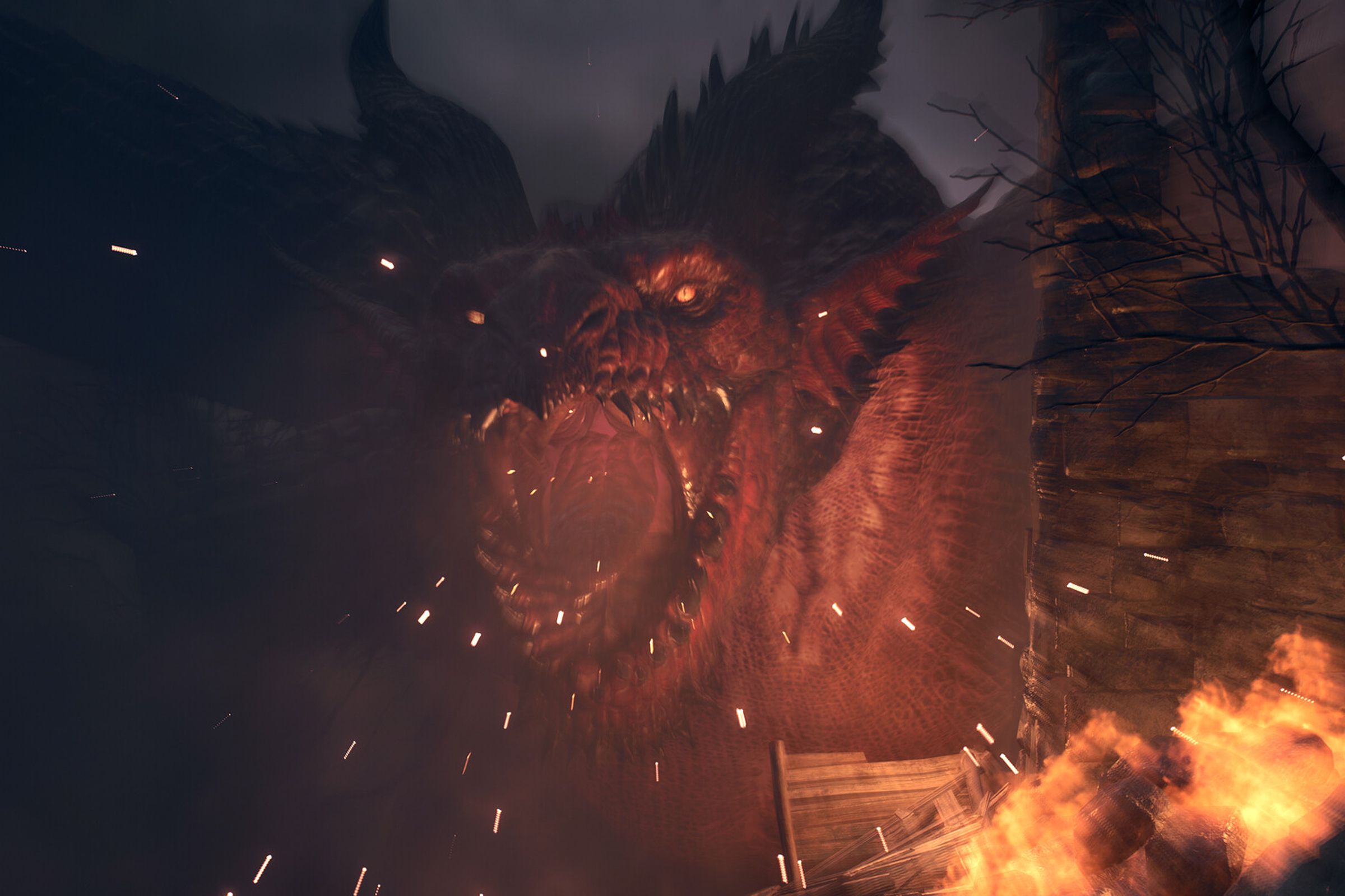 Screenshot from Dragon’s Dogma 2 featuring a large red dragon roaring as flames burn around the edges of the image