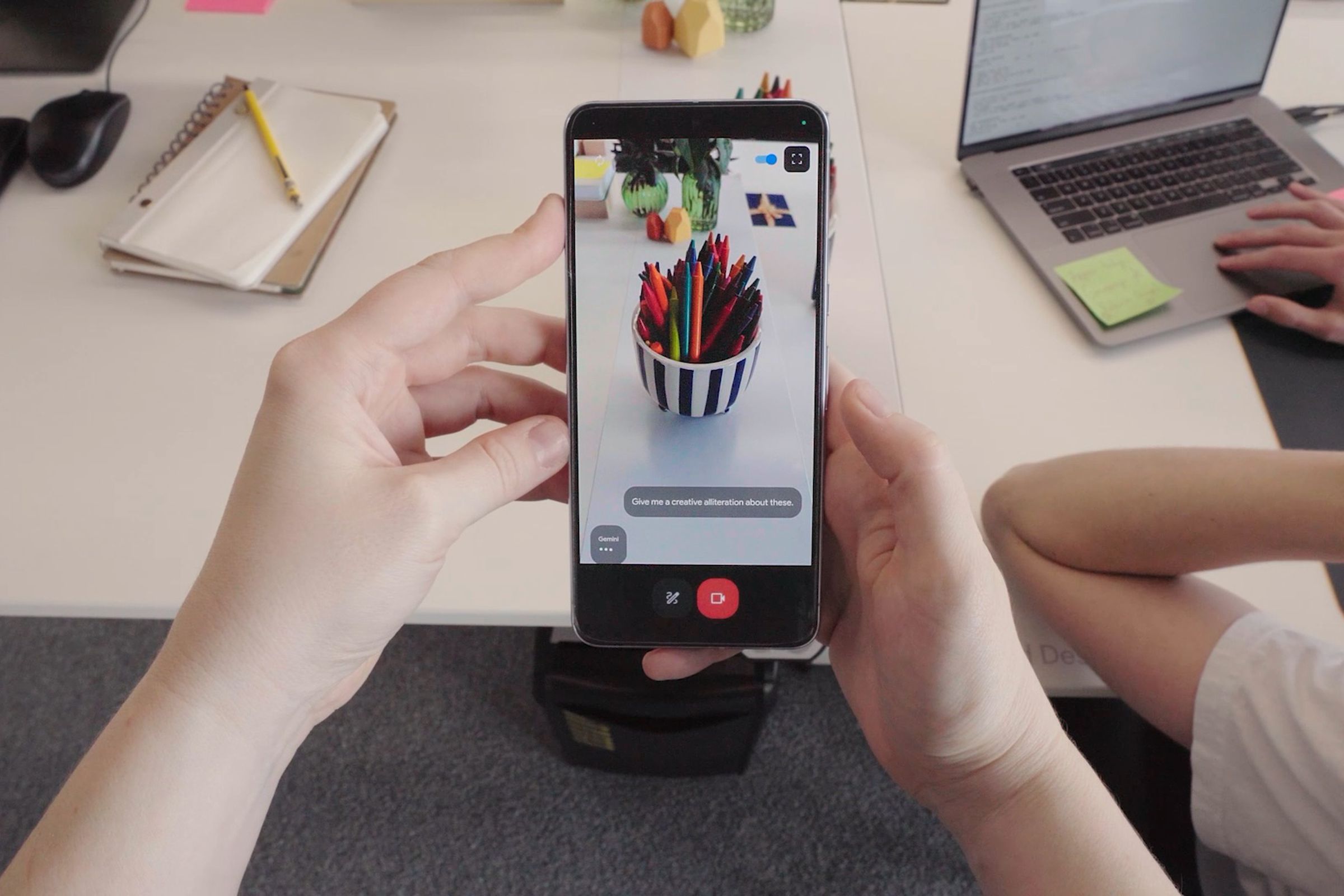 A still from a video showing a phone identifying a bowl of markers.