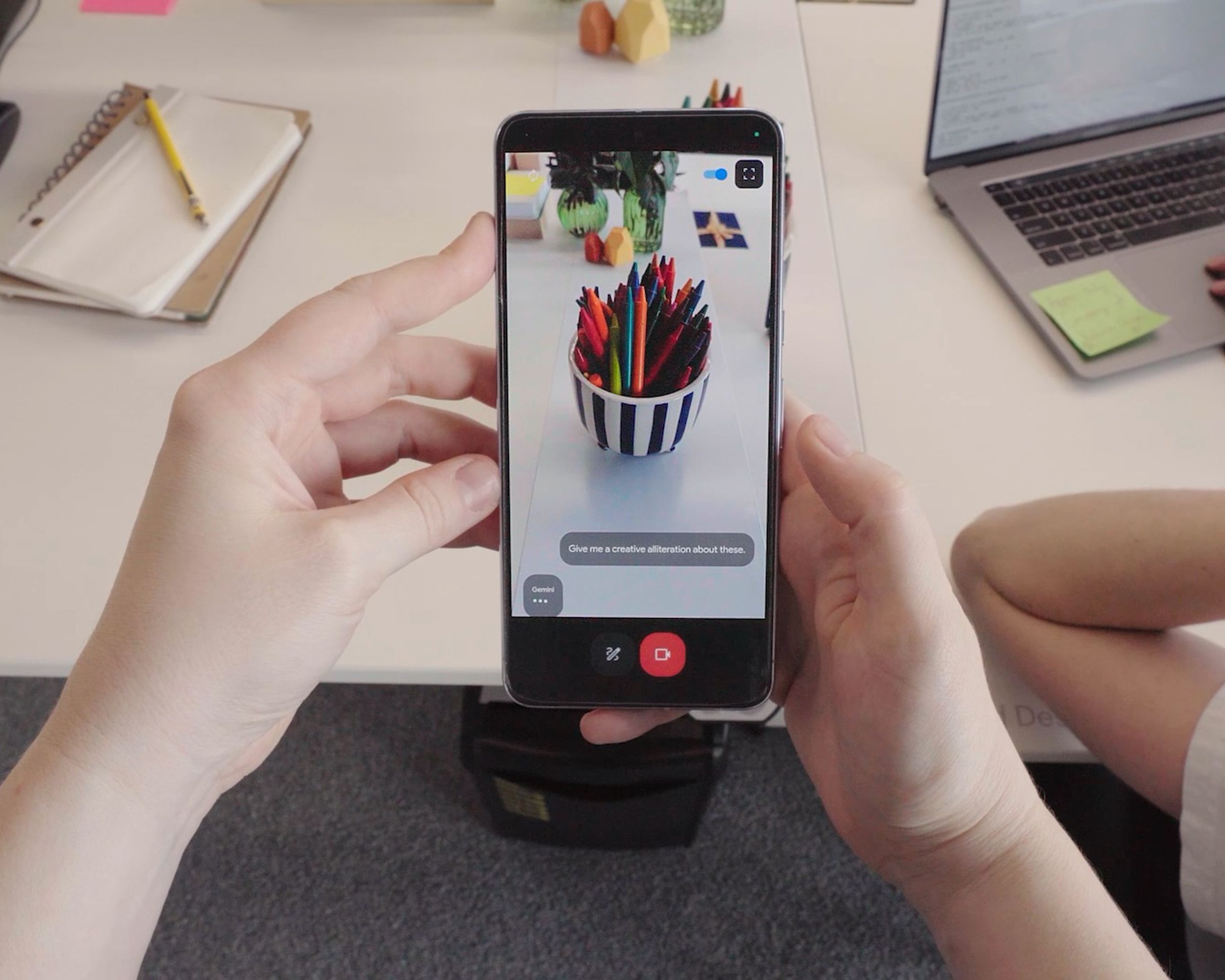A still from a video showing a phone identifying a bowl of markers.