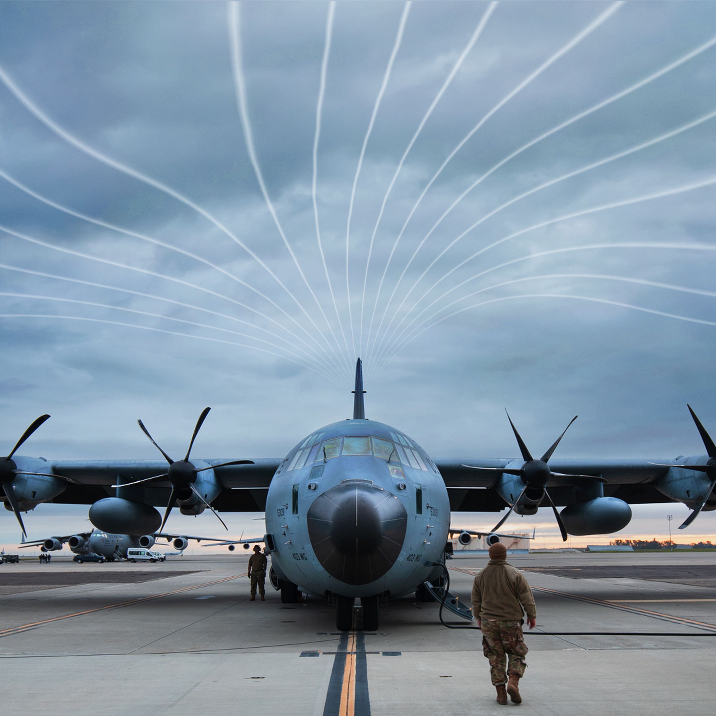 Air Force C130 plane on tarmac, with illustrated “atmospheric river” lines in the sky