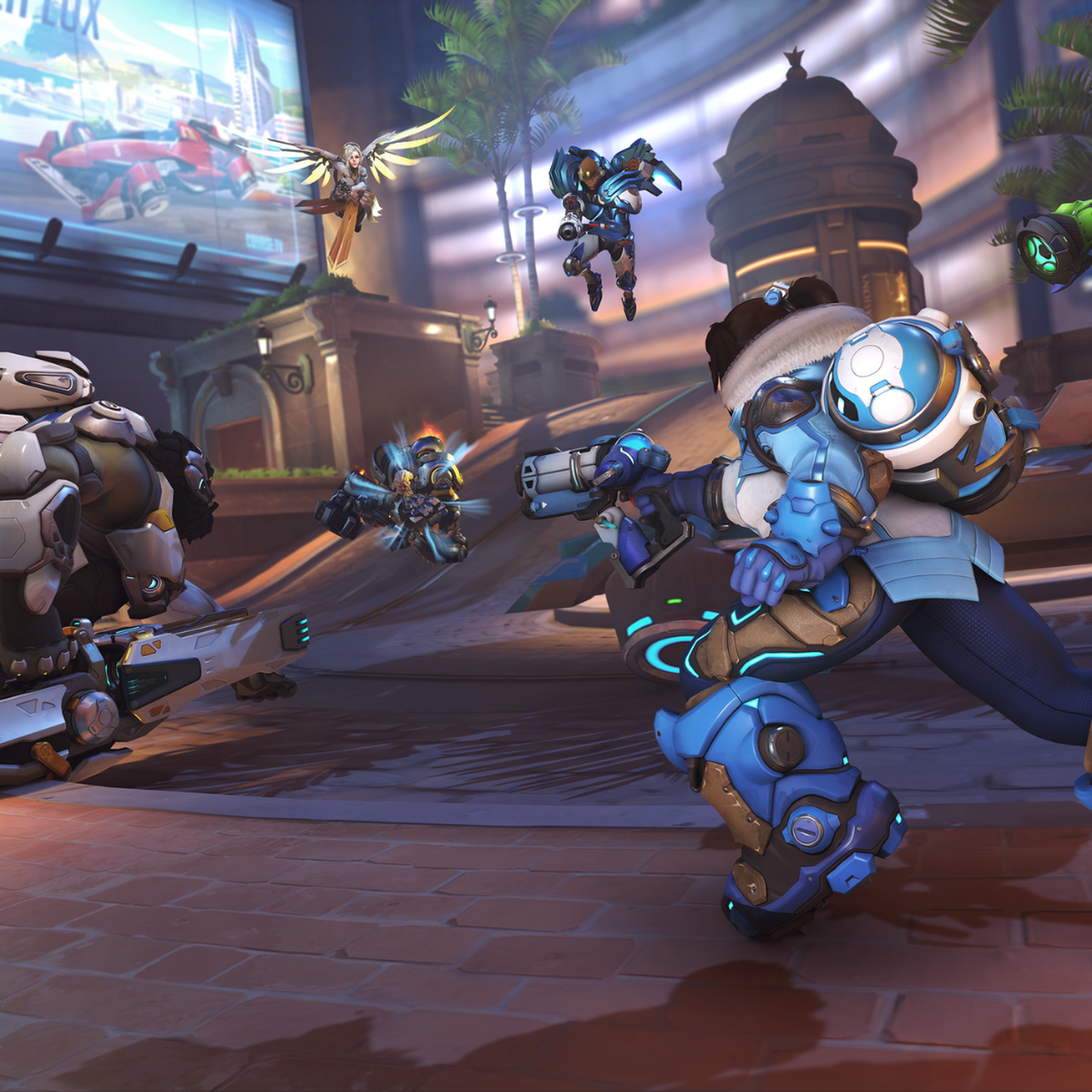 Screenshot from Overwatch 2 featuring two teams comprised of heroes Mei, Winston, Pharah, Mercy, Reinhardt, and Lucio fighting over the payload on the Circuit Royal map.