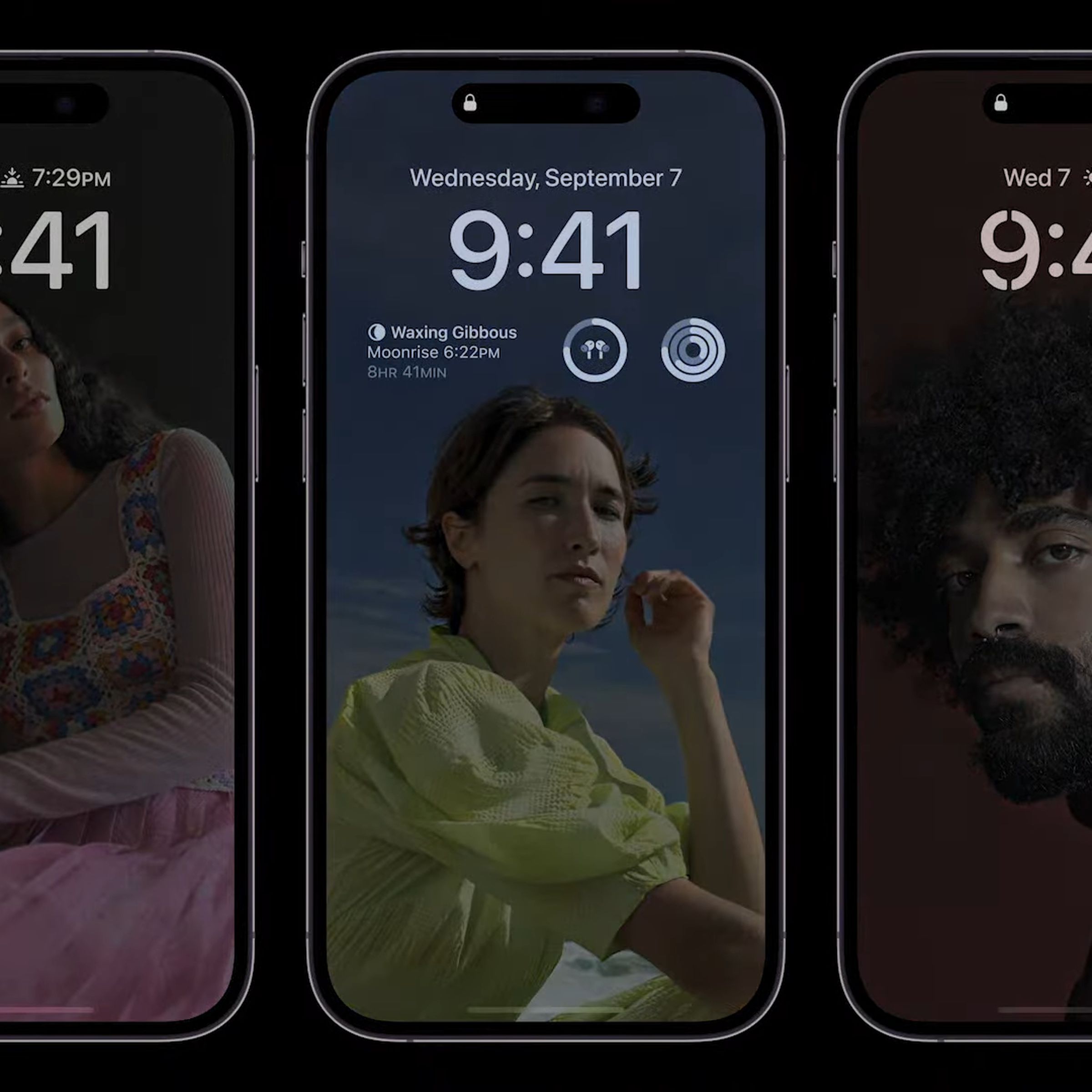 iPhone 14 Pro models side by side showcasing Apple’s new always-on display mode