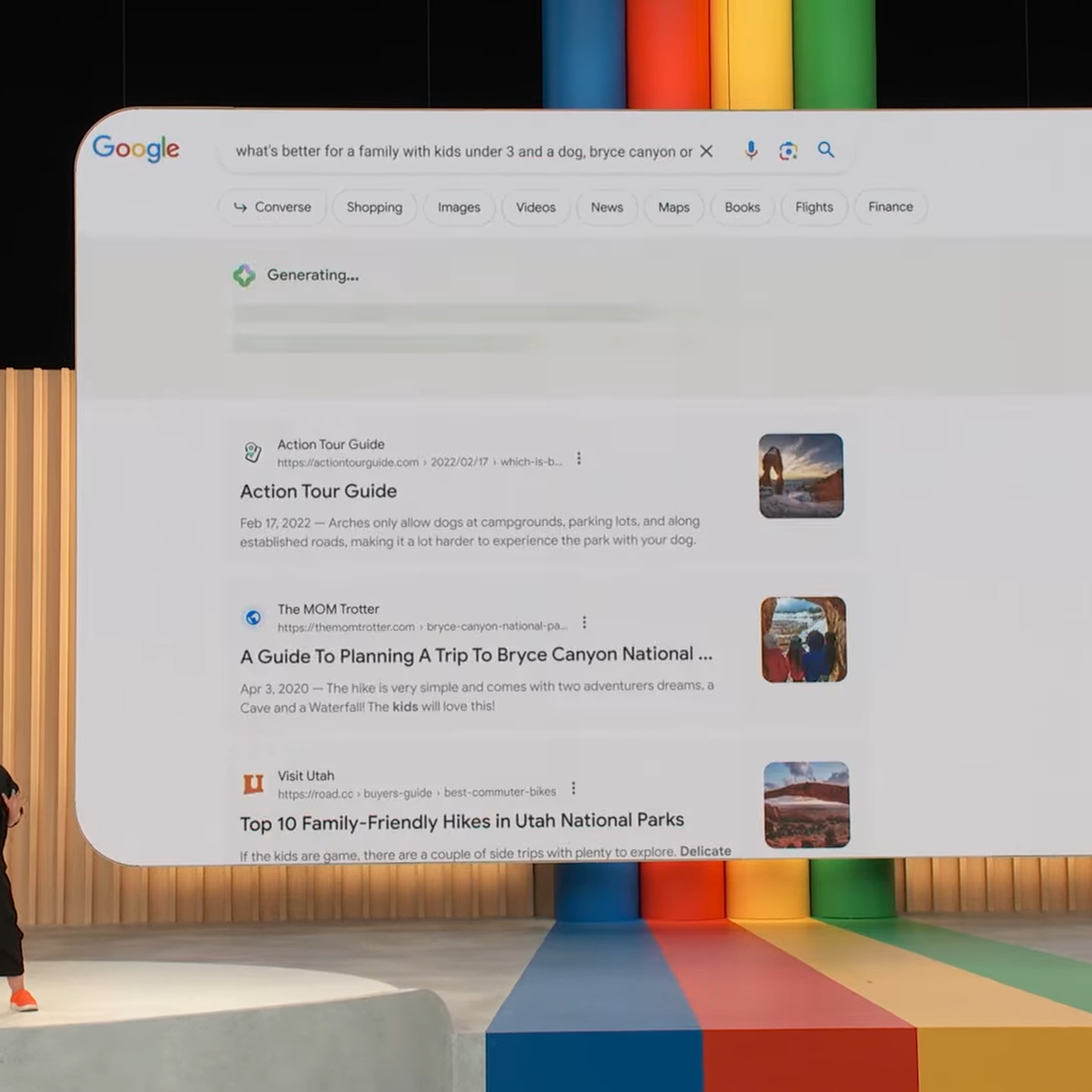 A photo from Google I/O with a presenter showing Google’s Search Generative Experience.