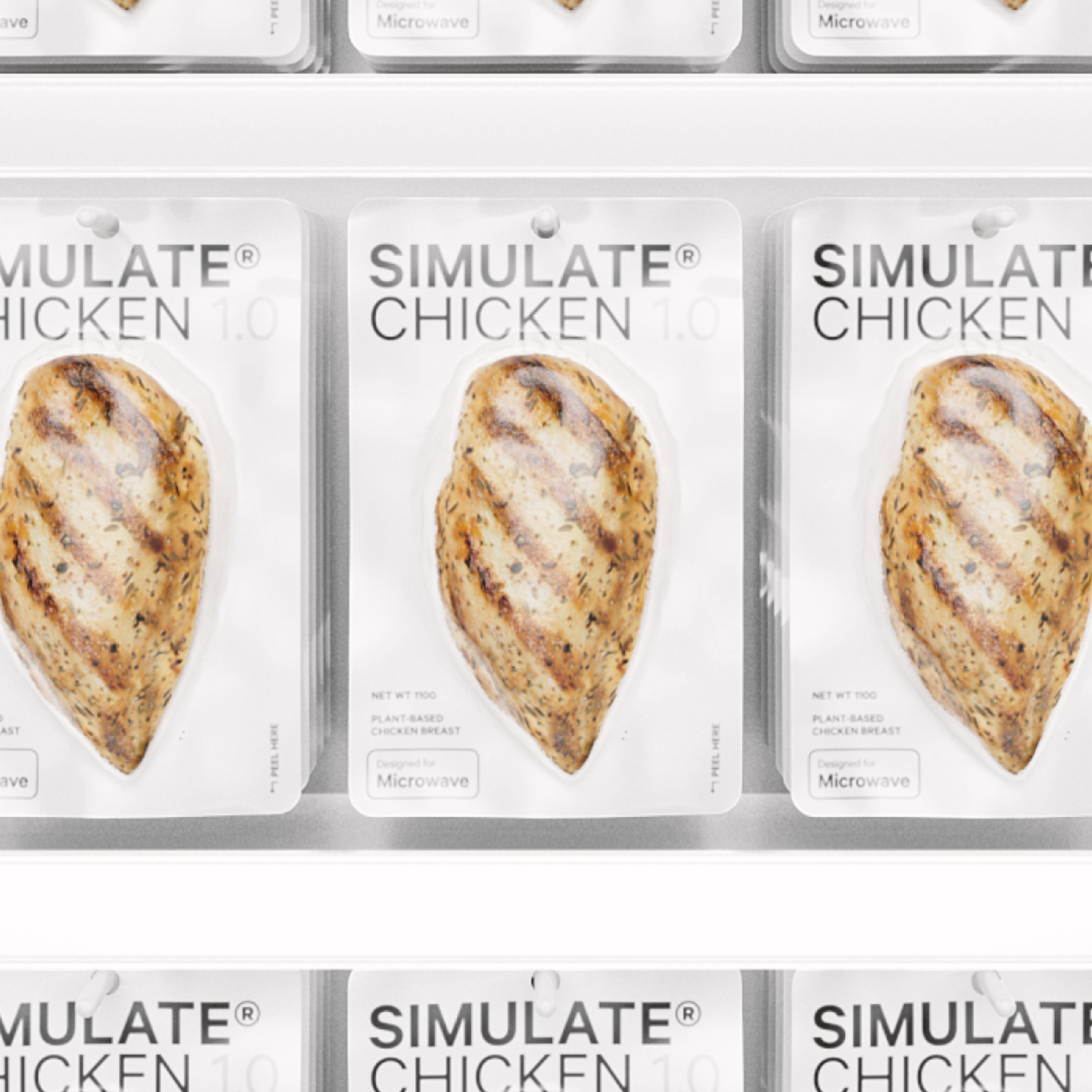 Rows of individually wrapped chicken breasts hanging on a store display