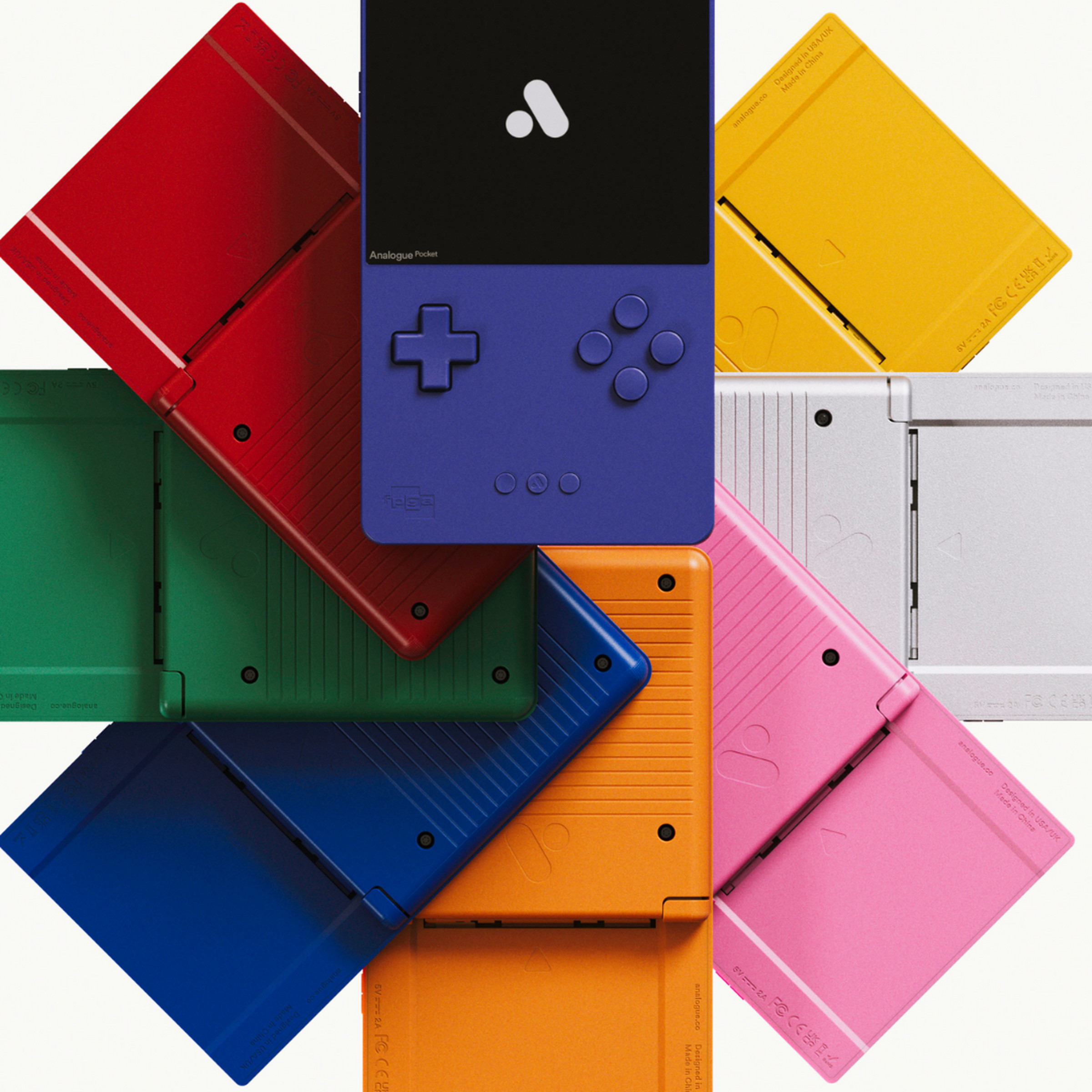 Product image of the Analogue Pocket Classic Limited Edition featuring a circular display of eight Analogue Pocket handheld consoles in colors clockwise from the top: indigo, yellow, silver, pink, spice orange, blue, green, and red.