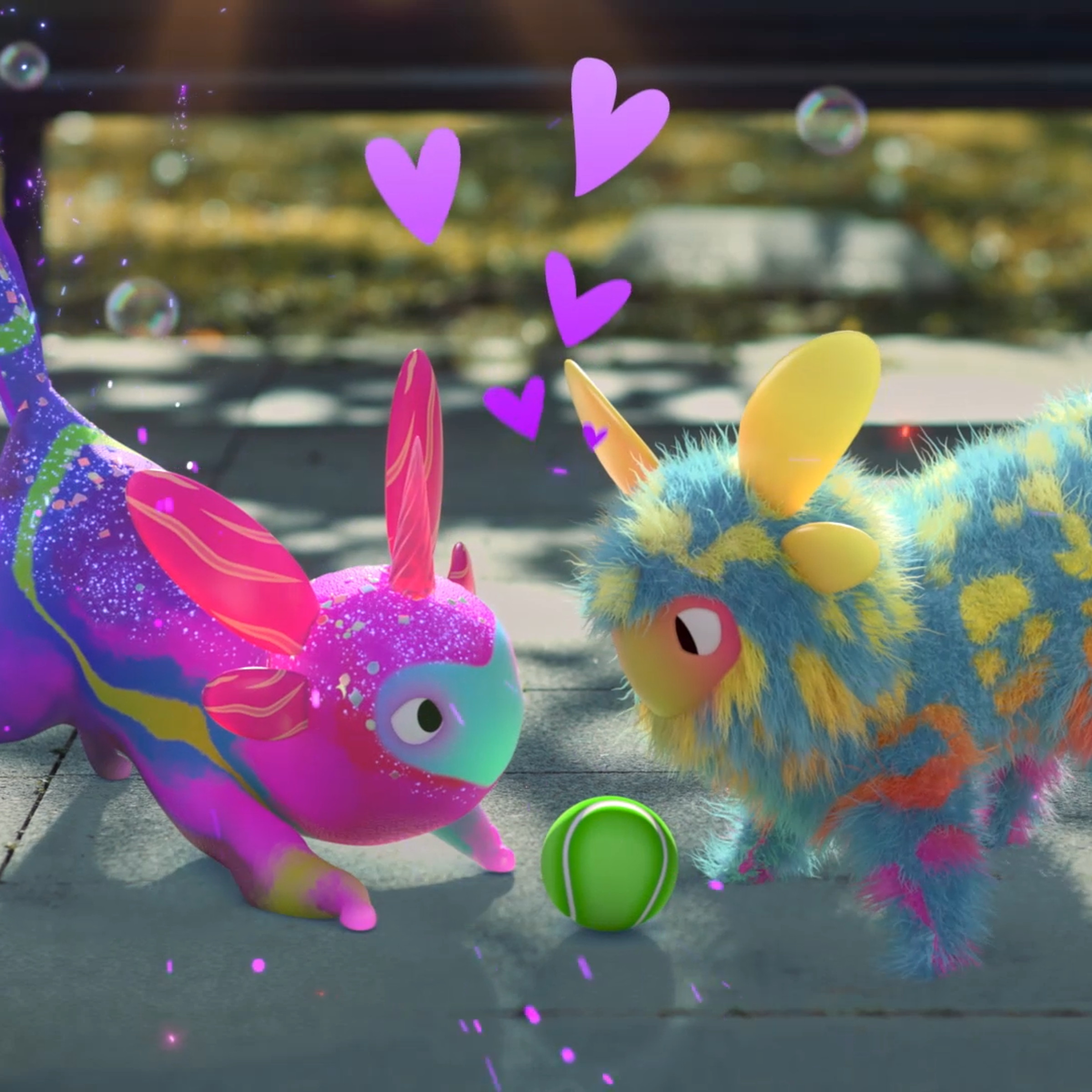 Screenshot from Peridot featuring two “Dots” — colorful alien pet creatures playing with a tennis ball.