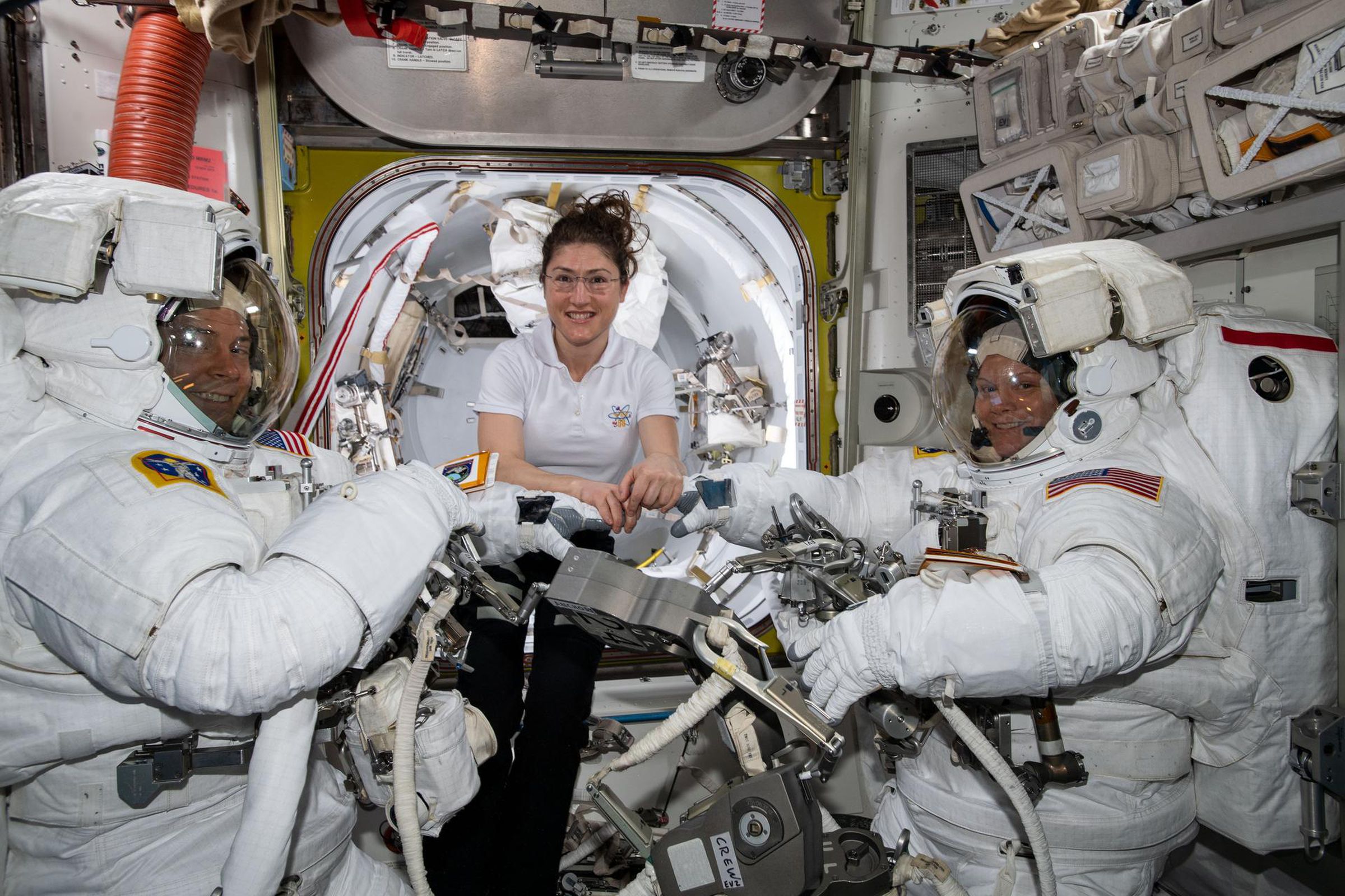 NASA astronauts Nick Hague (L), Christina Koch (C), and Anne McClain (R).