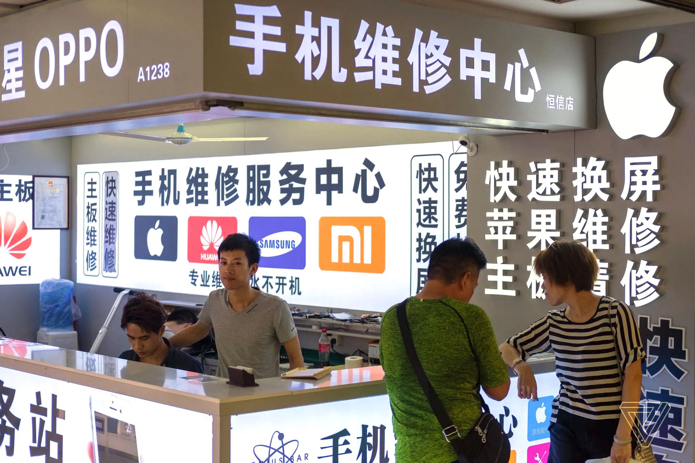 A phone repair store at a technology market in Shenzhen, China.