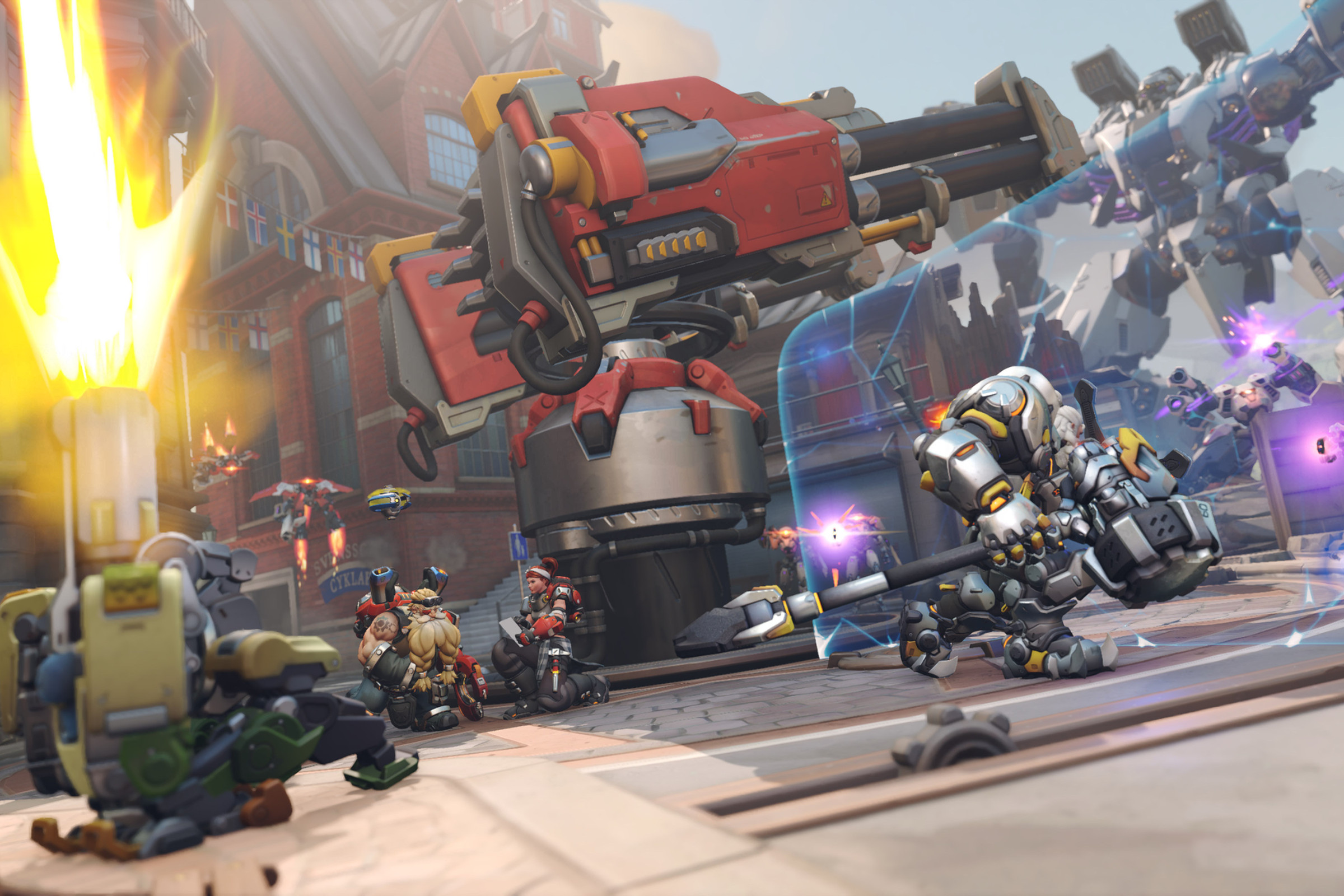 Screenshot from Overwatch 2 featuring the Gothenburg story mission including the heroes Reinhardt, Bastion, Torbjorn and Brigitte defending a huge cannon from an even bigger mech enemy
