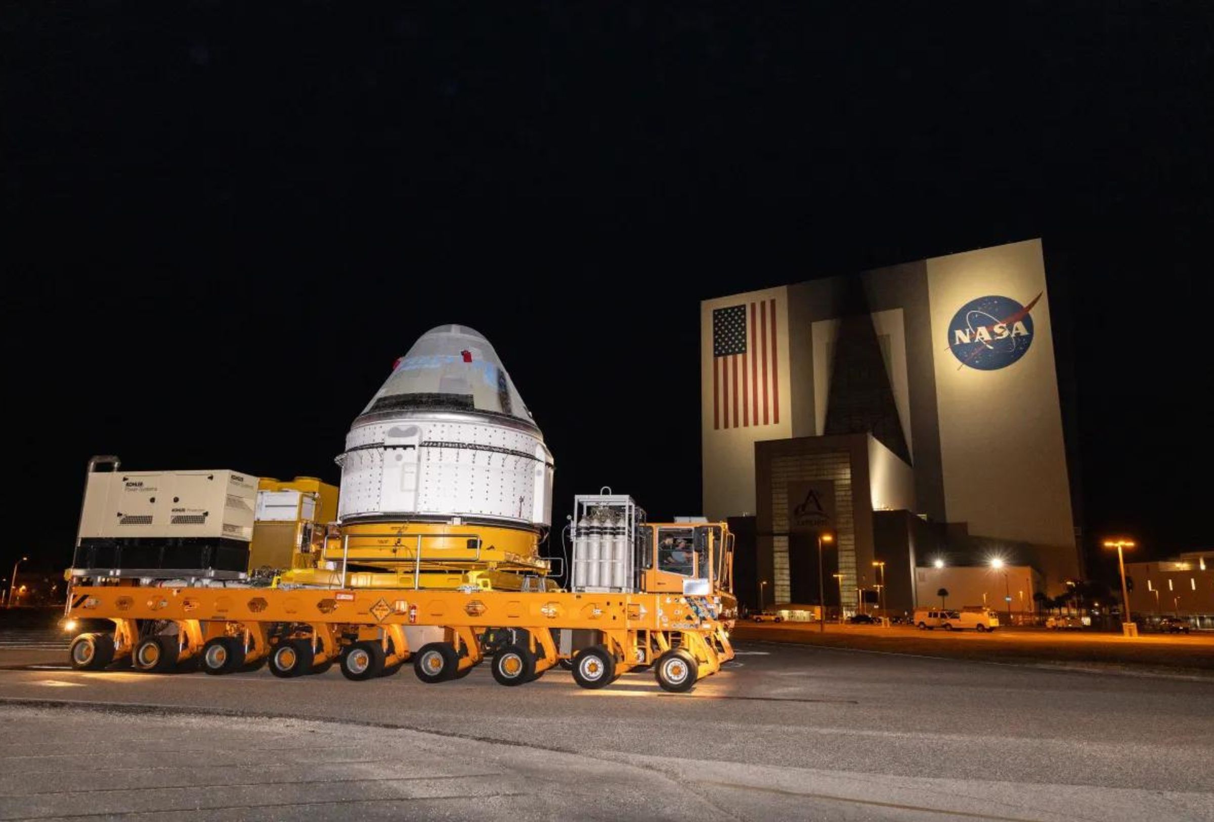 Boeing’s Starliner spacecraft, set to carry NASA astronauts Butch Wilmore and Suni Williams on the agency’s Boeing Crew Flight Test to the International Space Station, passes in front of the iconic Vehicle Assembly Building at NASA’s Kennedy Space Center in Florida.