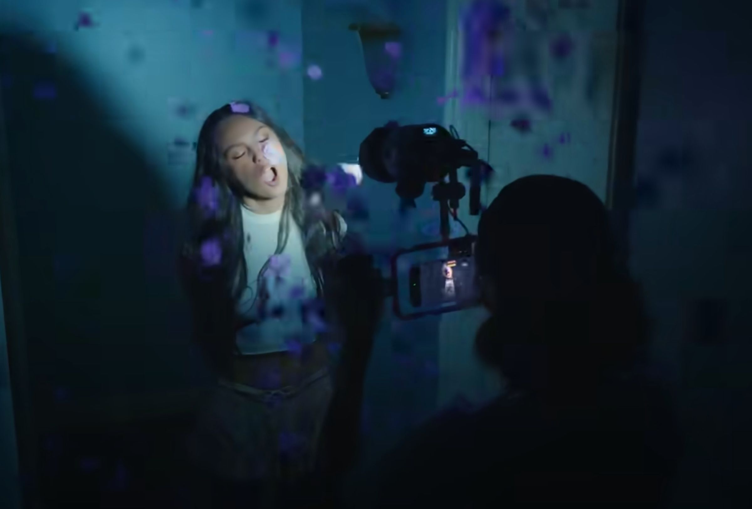 Olivia Rodrigo being filmed on an iPhone 15 Pro Max for her “Get Him Back” music video