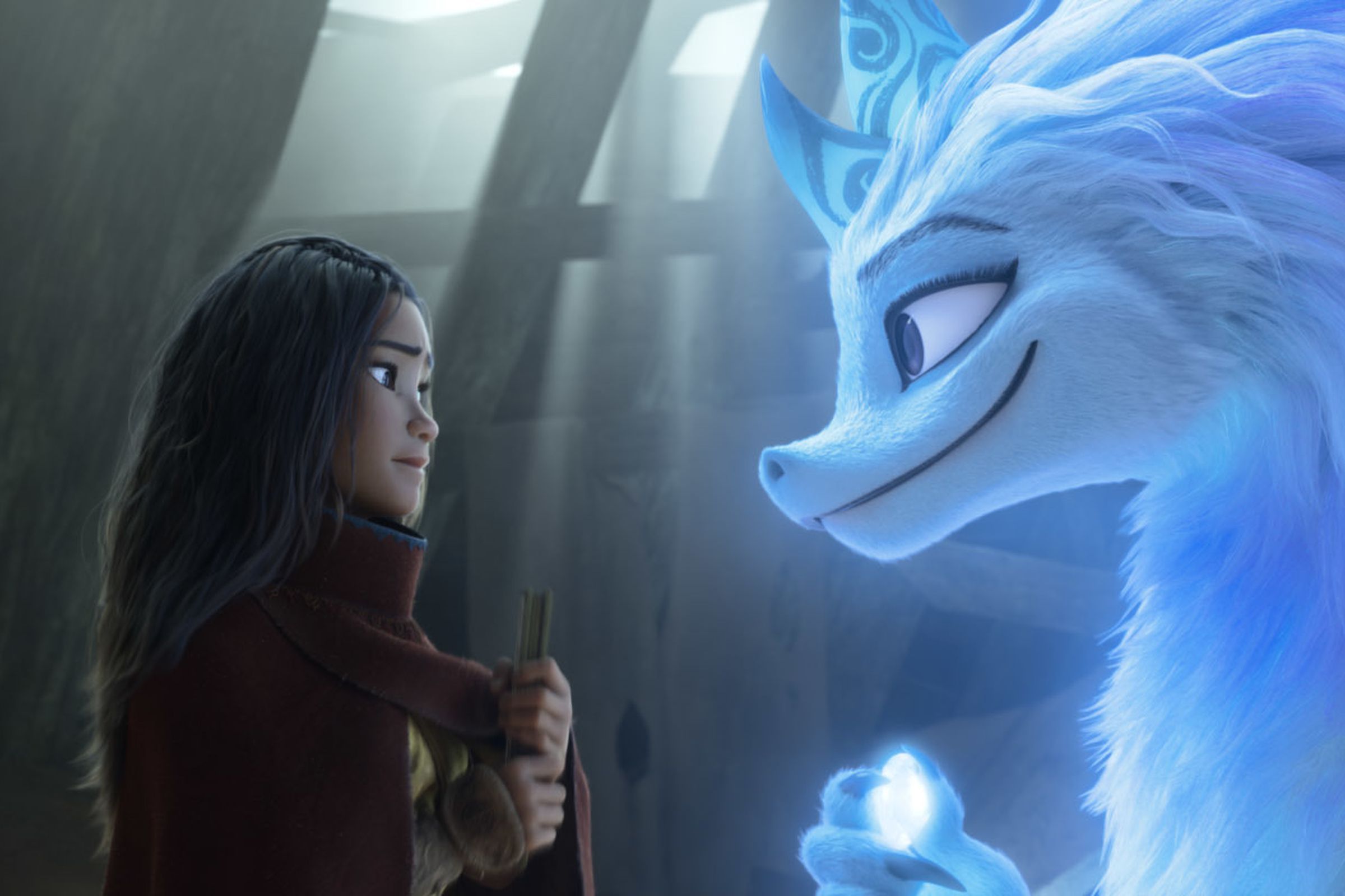 Raya, voiced by Kelly Marie Tran, seeks the help of the legendary dragon Sisu, voiced by Awkwafina. 