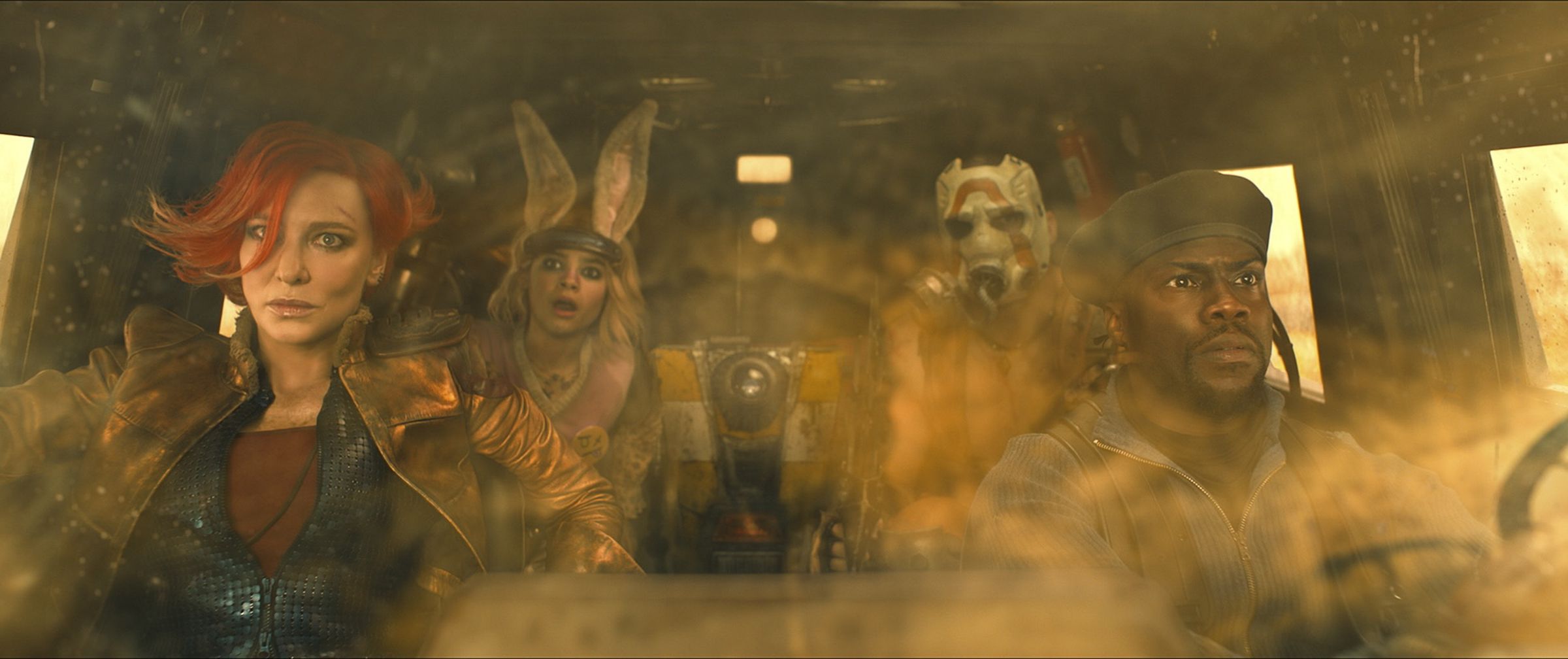 Production photo from the Borderlands movie featuring Cate Blanchett as Lilith, Ariana Greenblatt as Tiny Tina, Florian Munteanu as Krieg, and Kevin Hart as Roland.