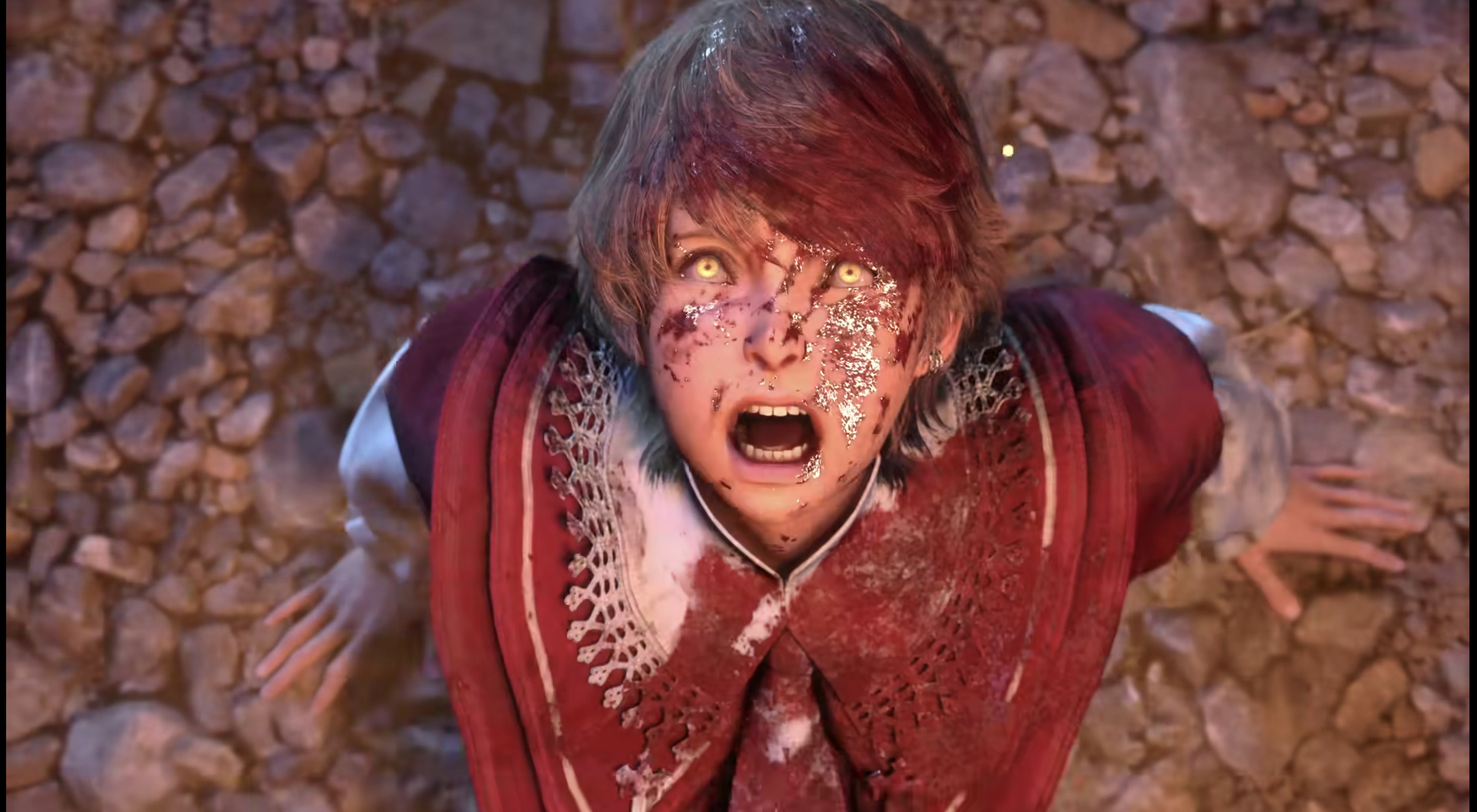 Screenshot from Final Fantasy XVI trailer featuring a young boy who’s face is covered with blood