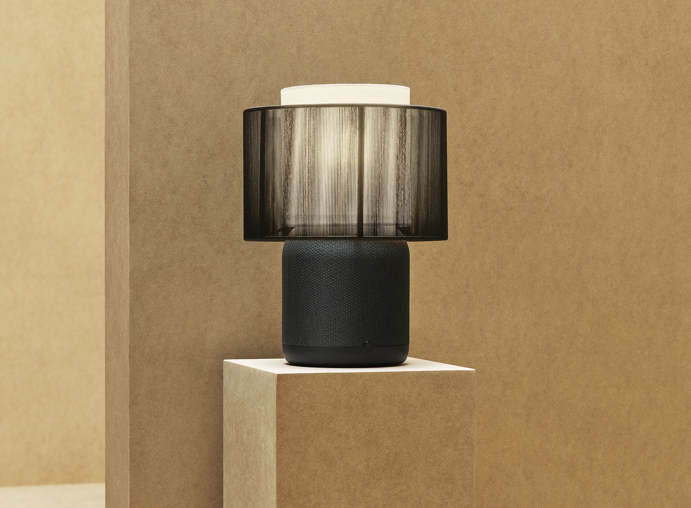 The textile lampshade has a much different look.