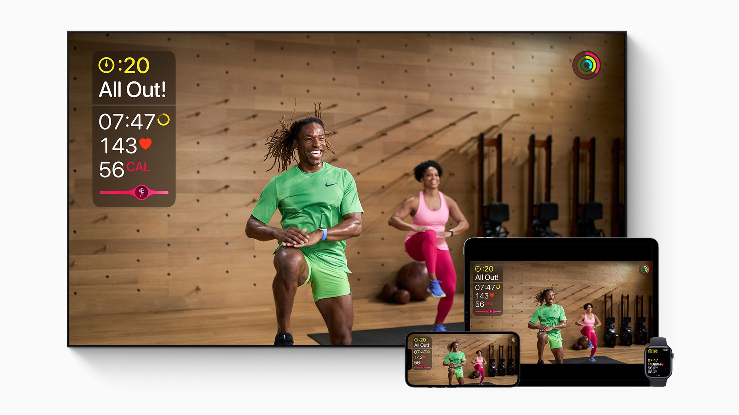 Fitness Plus workout depicted on a TV, iPad, iPhone, and Apple Watch