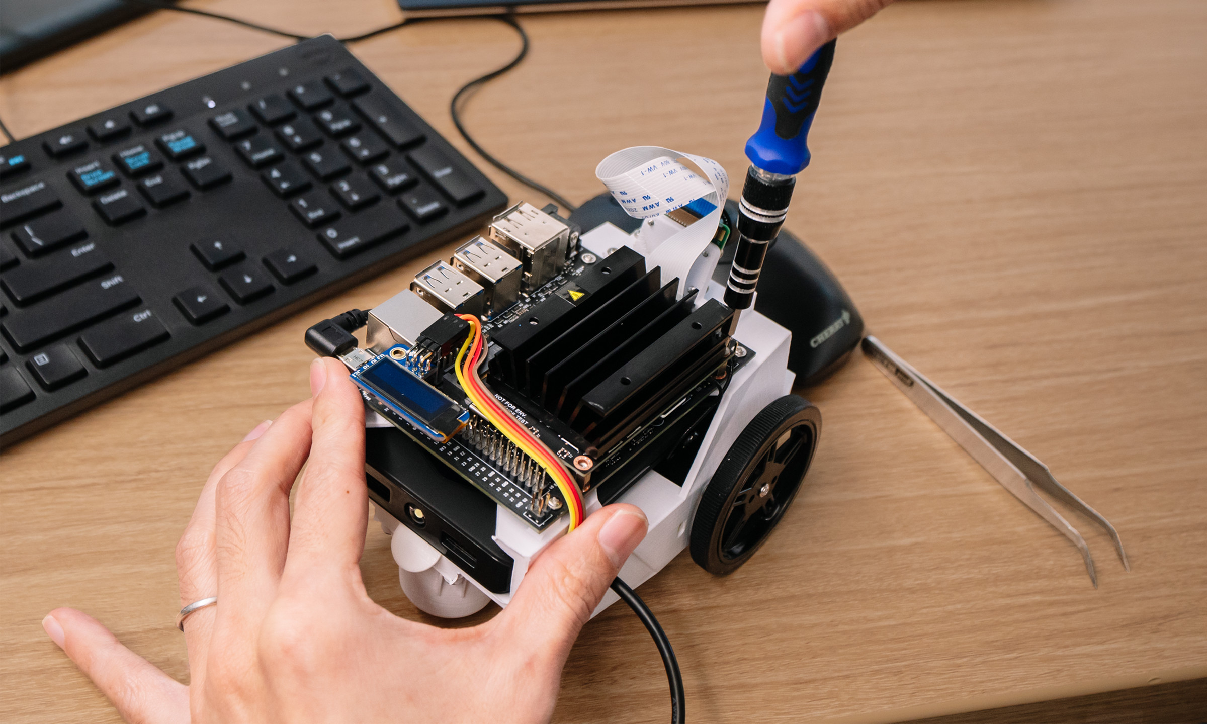 The Jetson Nano devkit being attached to Nvidia’s new open-source robotics kit, named JetBot.