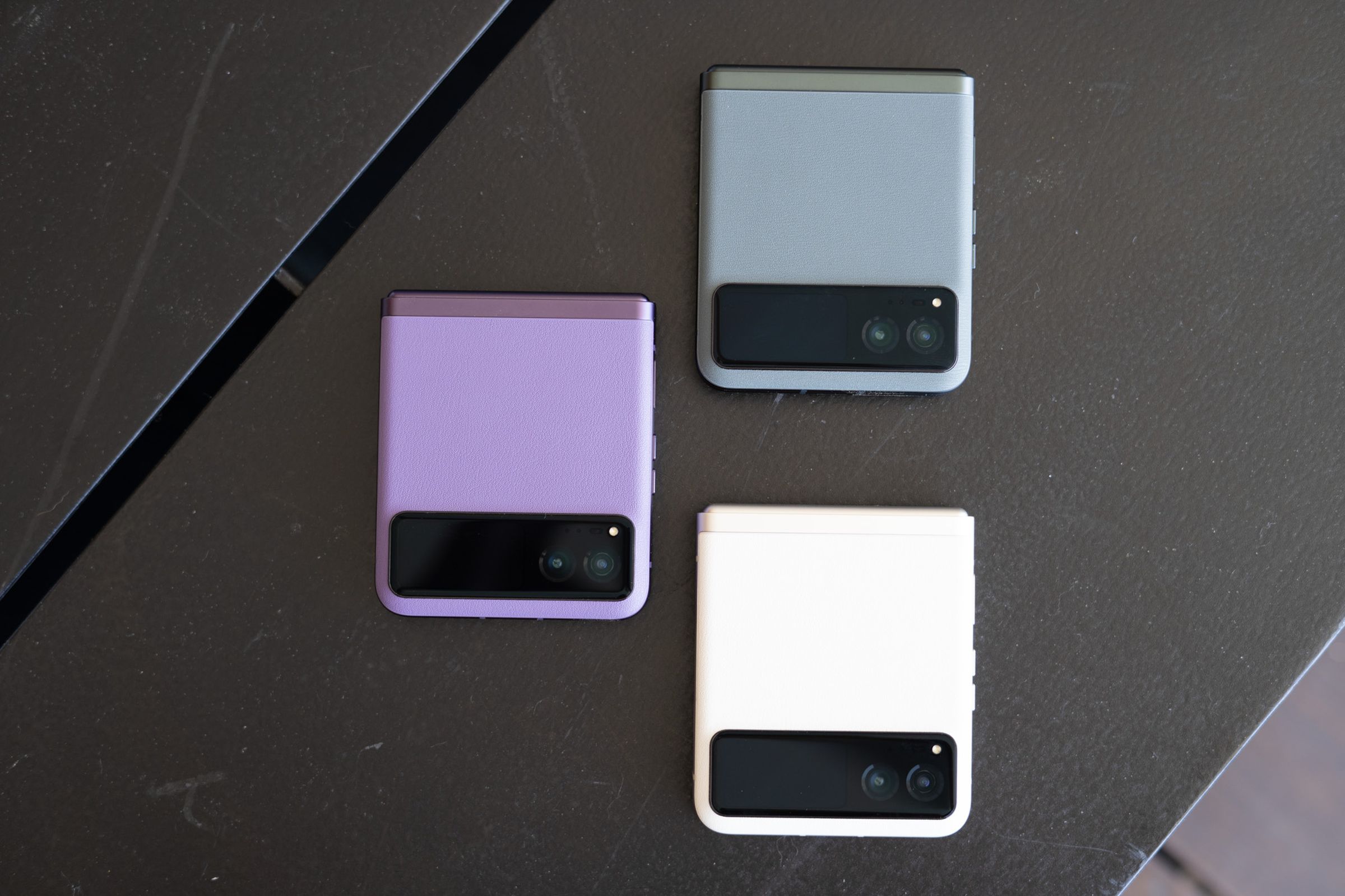 The 2023 Motorola Razr in all three color options: sage green, vanilla cream, and summer lilac.