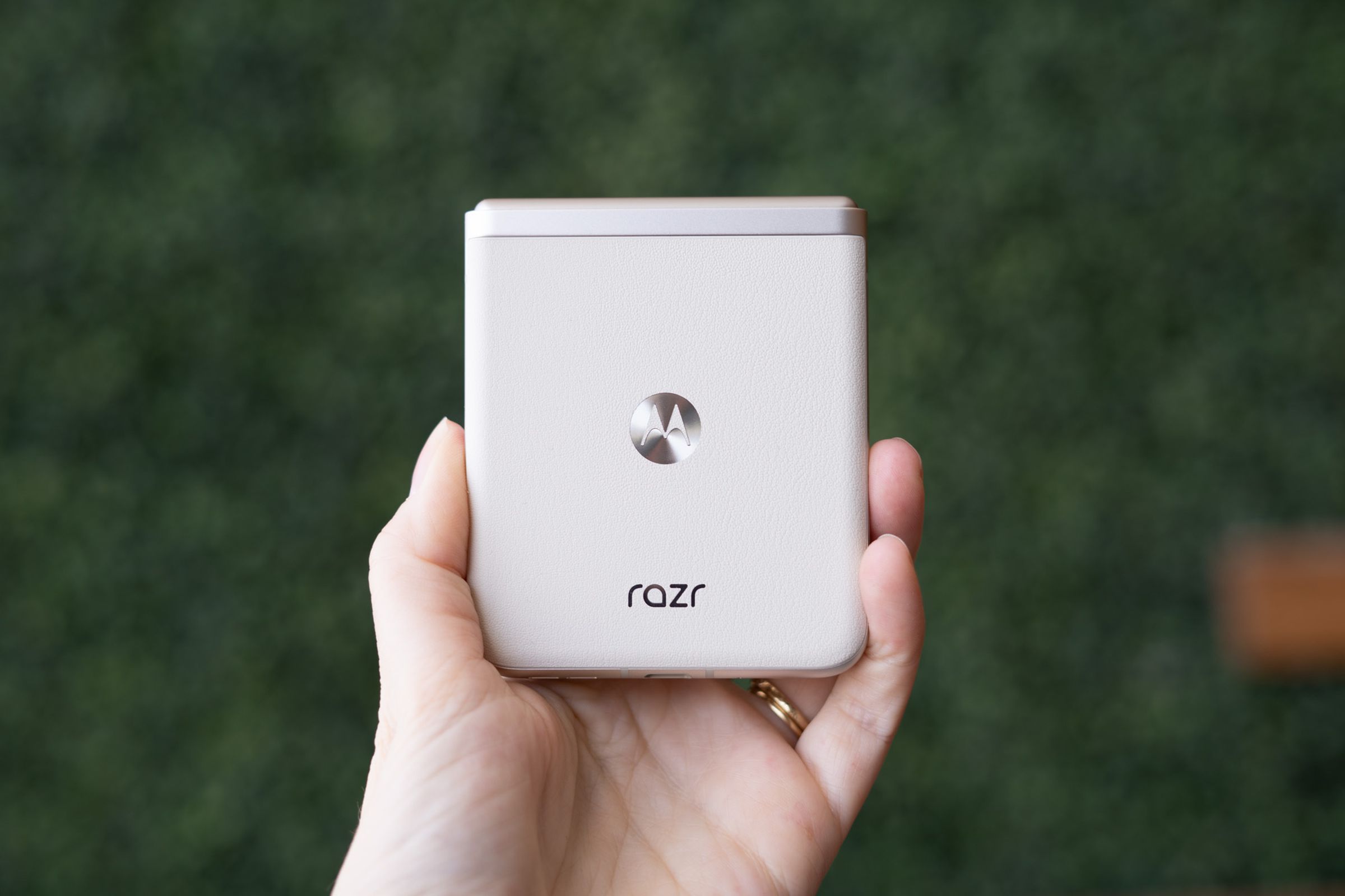 2023 Motorola Razr in vanilla cream showing back panel and Razr logo.