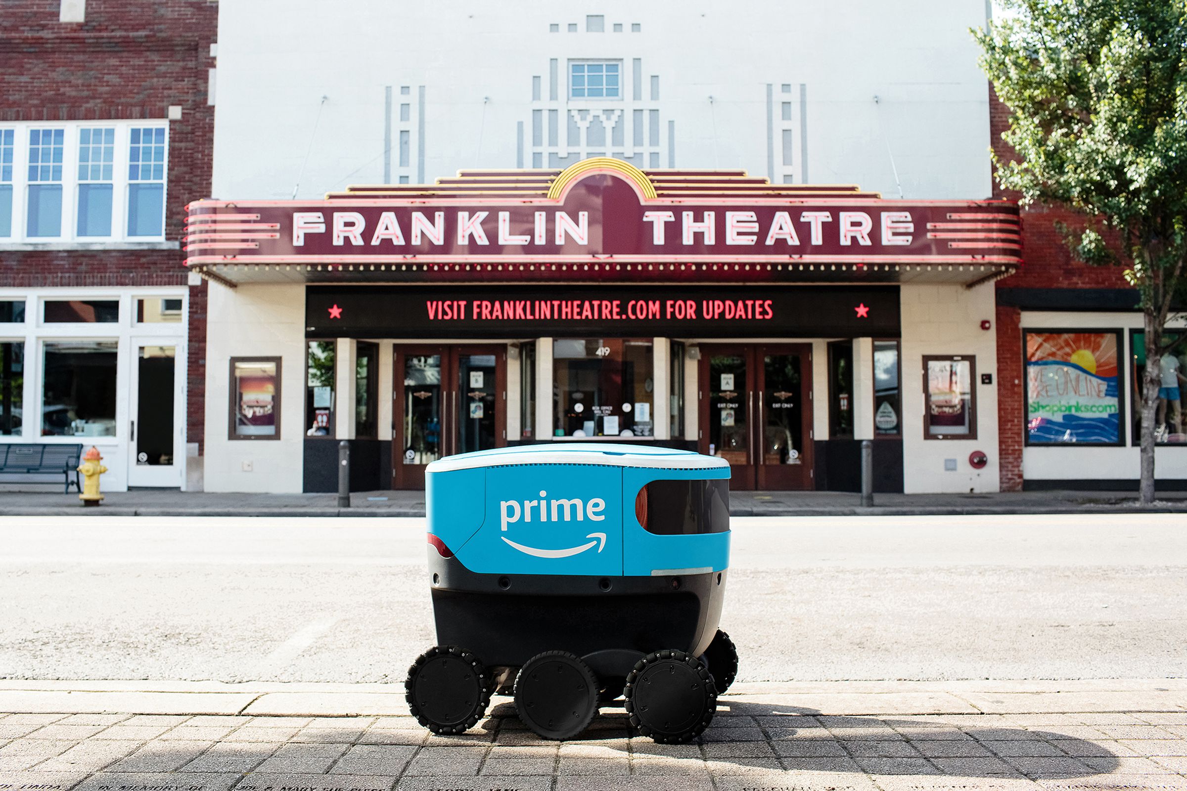 Amazon’s Scout robots navigate autonomously, but are accompanied by human minders at all times.