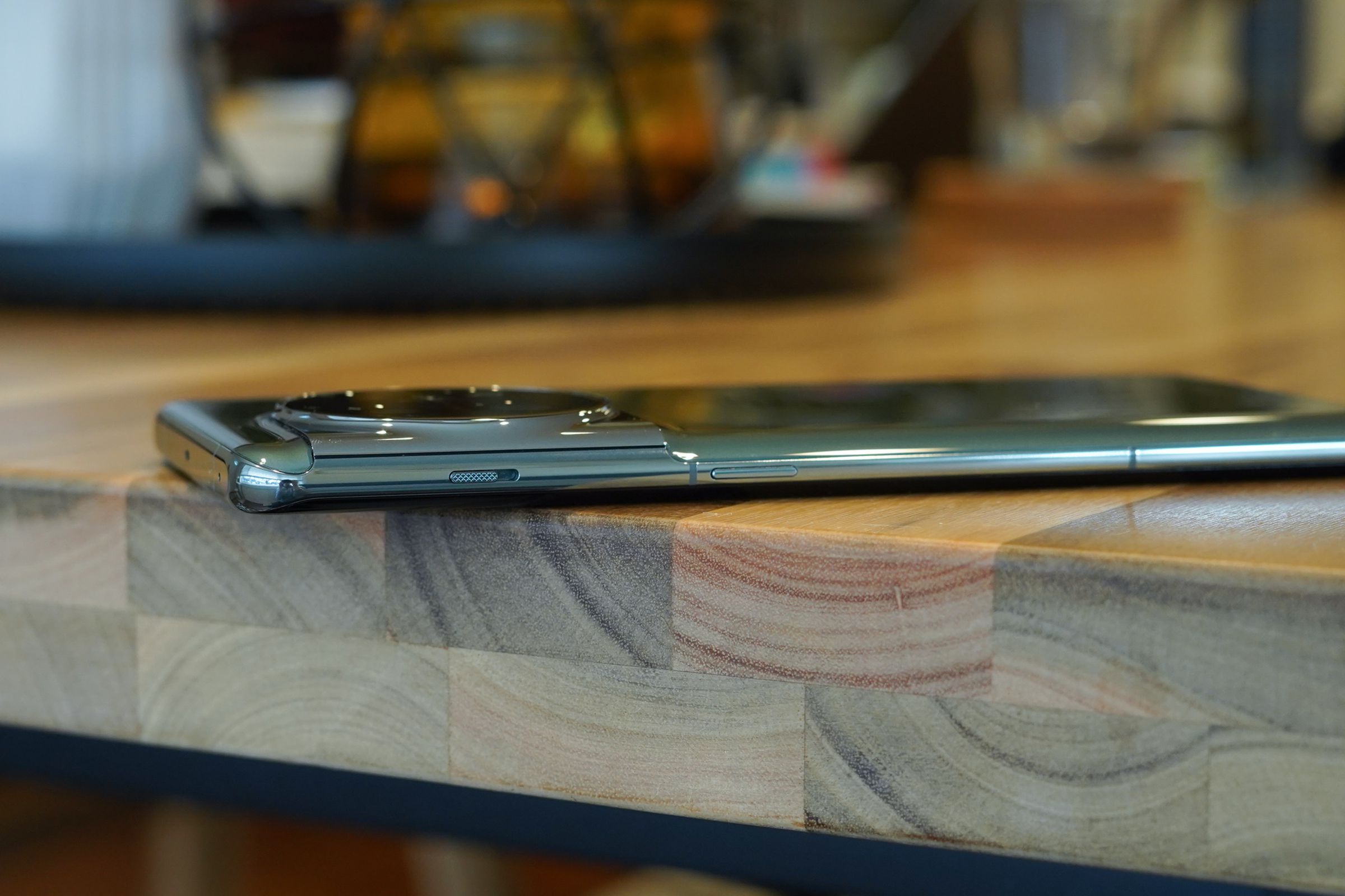 OnePlus 11 from a side angle showing the three-stage mute slider.