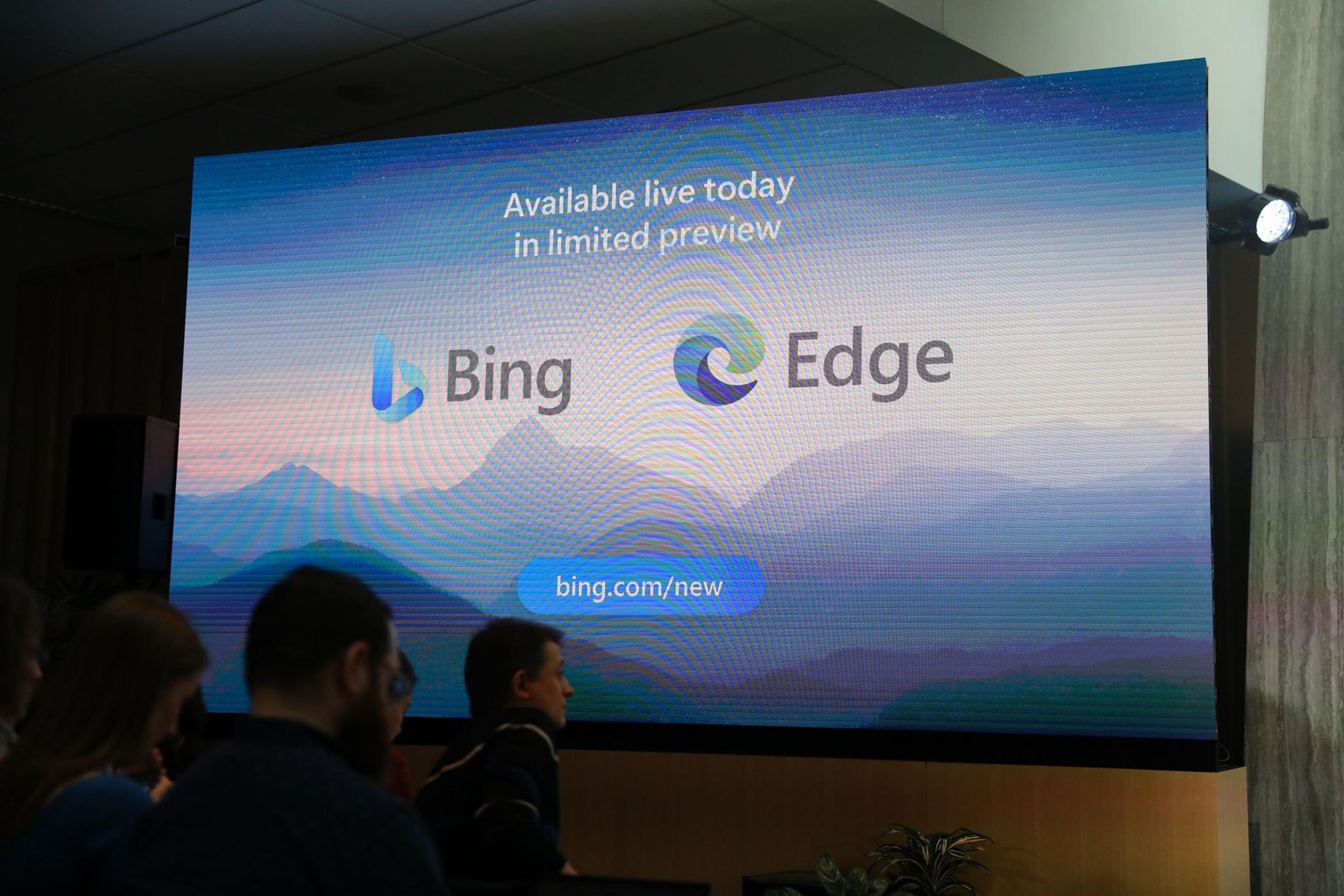A photo of a slide saying “available today in limited preview” with logos of Bing and Edge beneath. It lists a website bing.com/new.