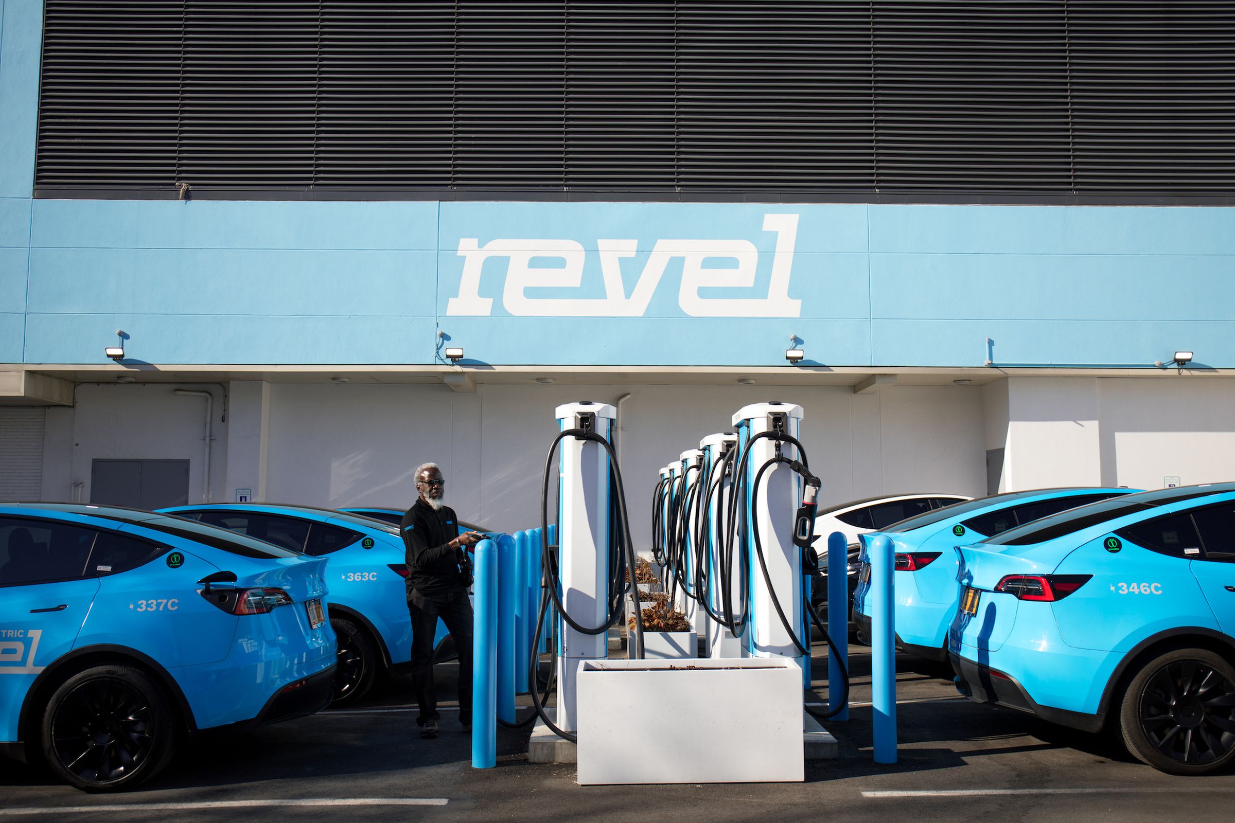 Revel’s Tesla Model Ys charging at an EV charging station