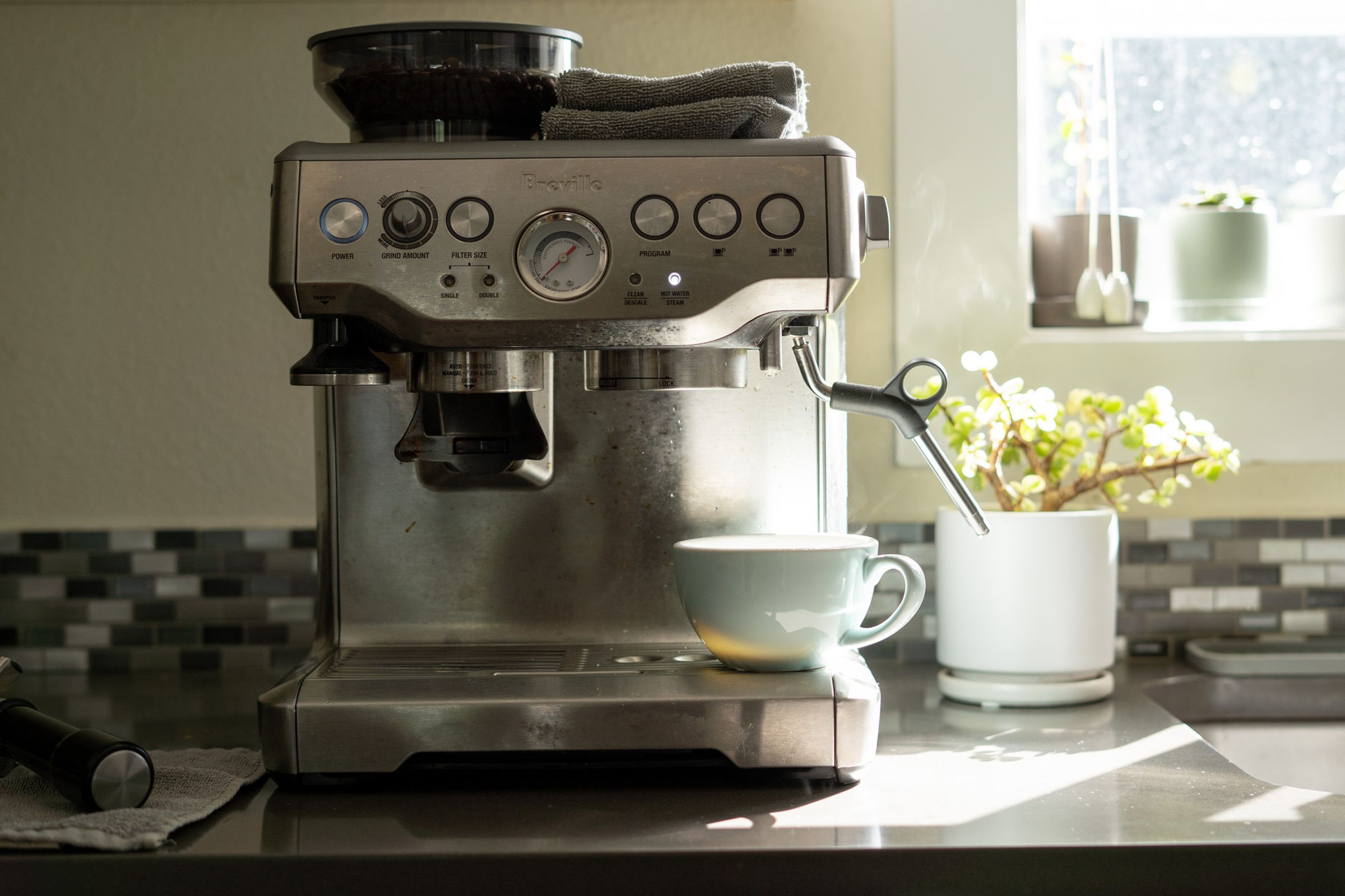 Photo of Breville espresso machine on a counter.