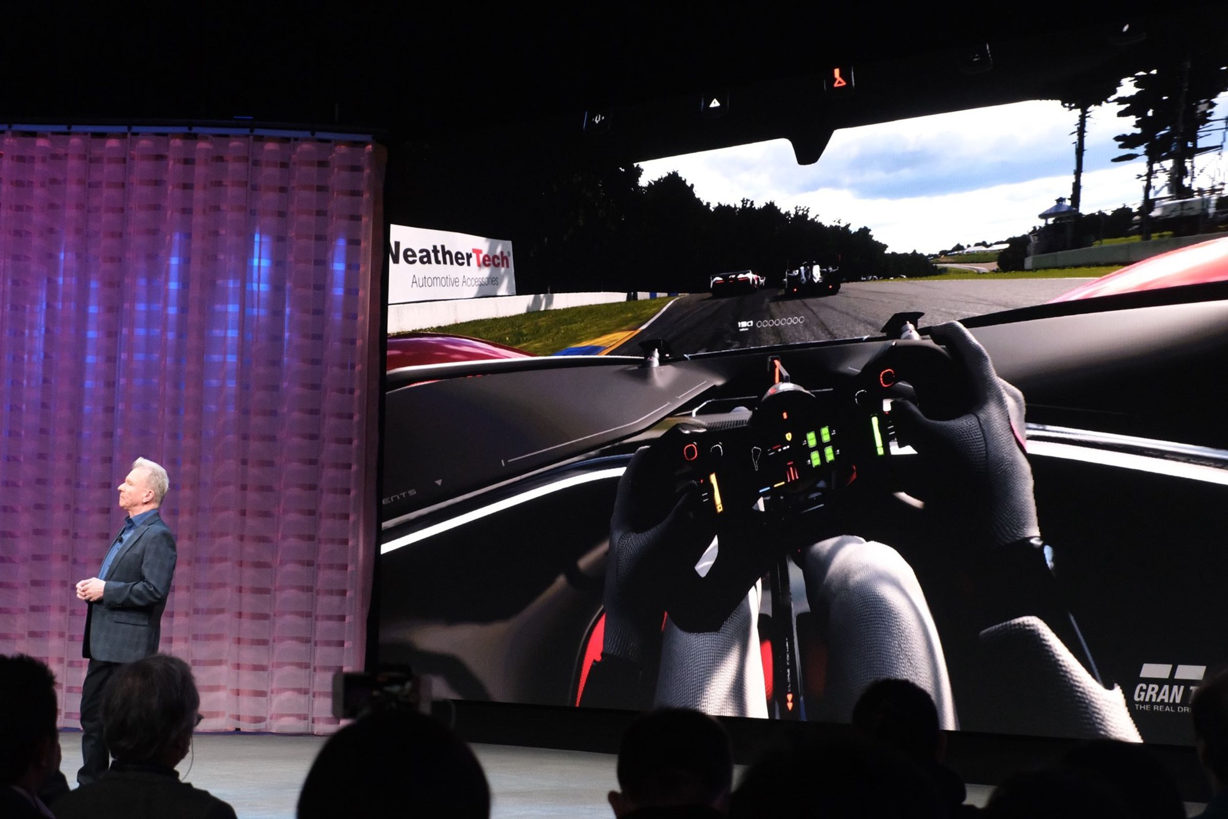 Jim Ryan reveals Gran Turismo 7’s VR update on stage at CES 2023.
