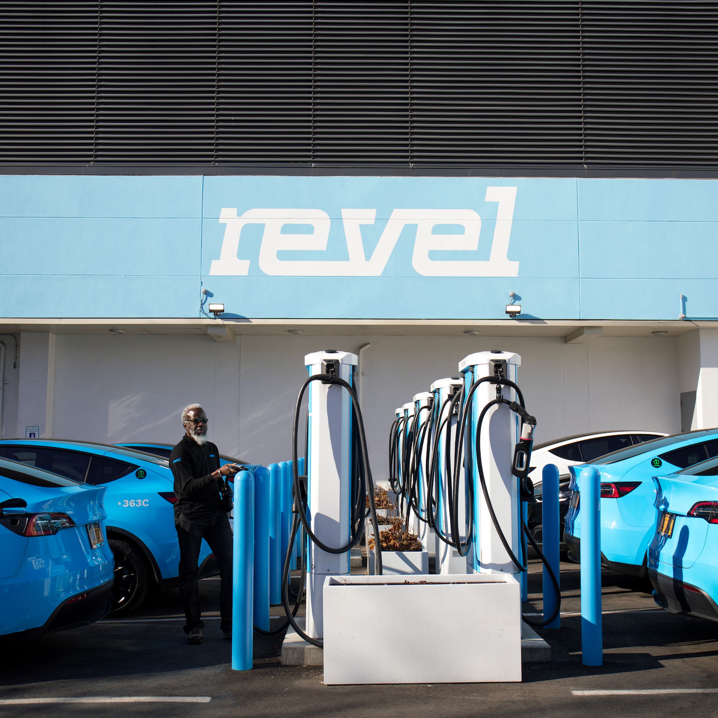 Revel’s Tesla Model Ys charging at an EV charging station