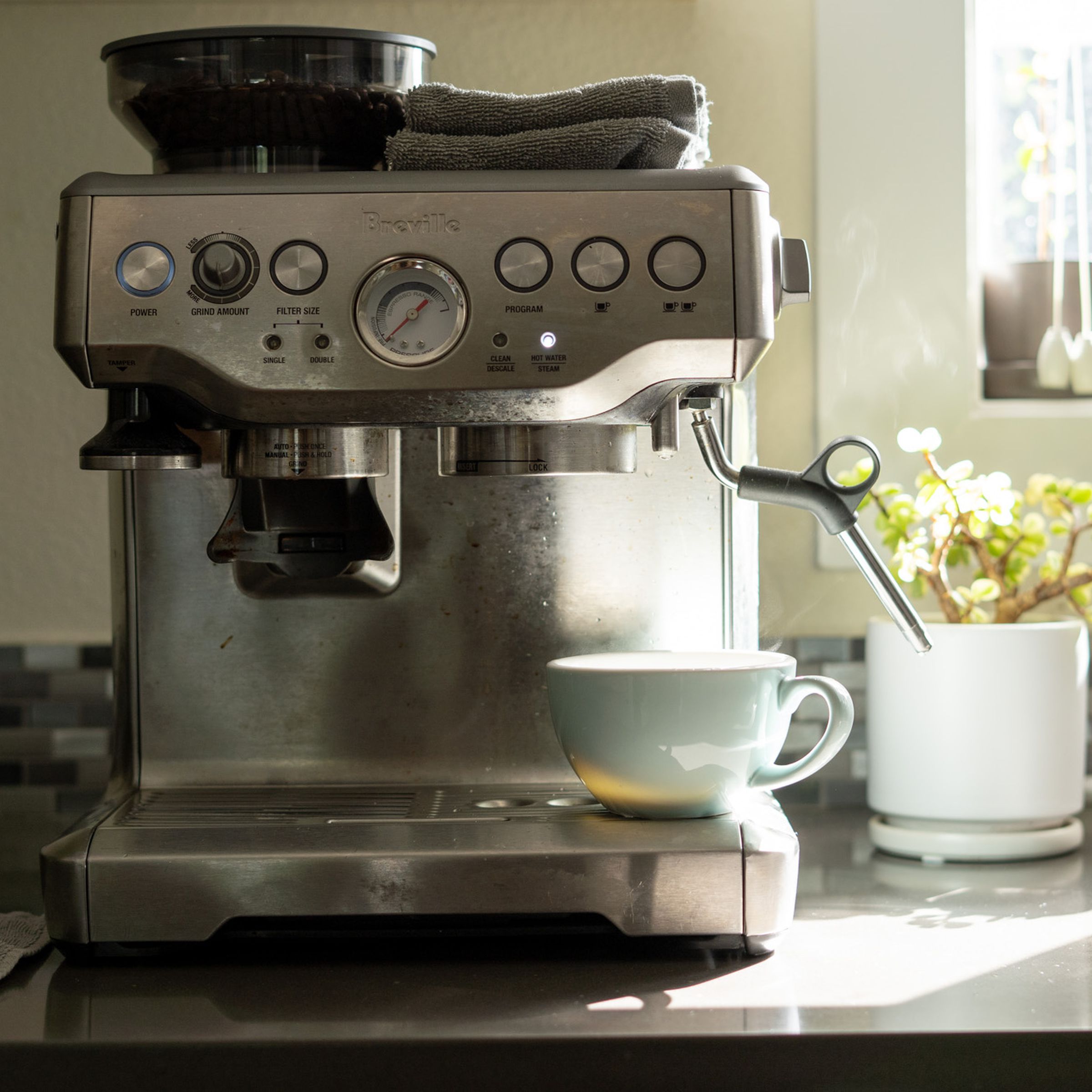 Photo of Breville espresso machine on a counter.