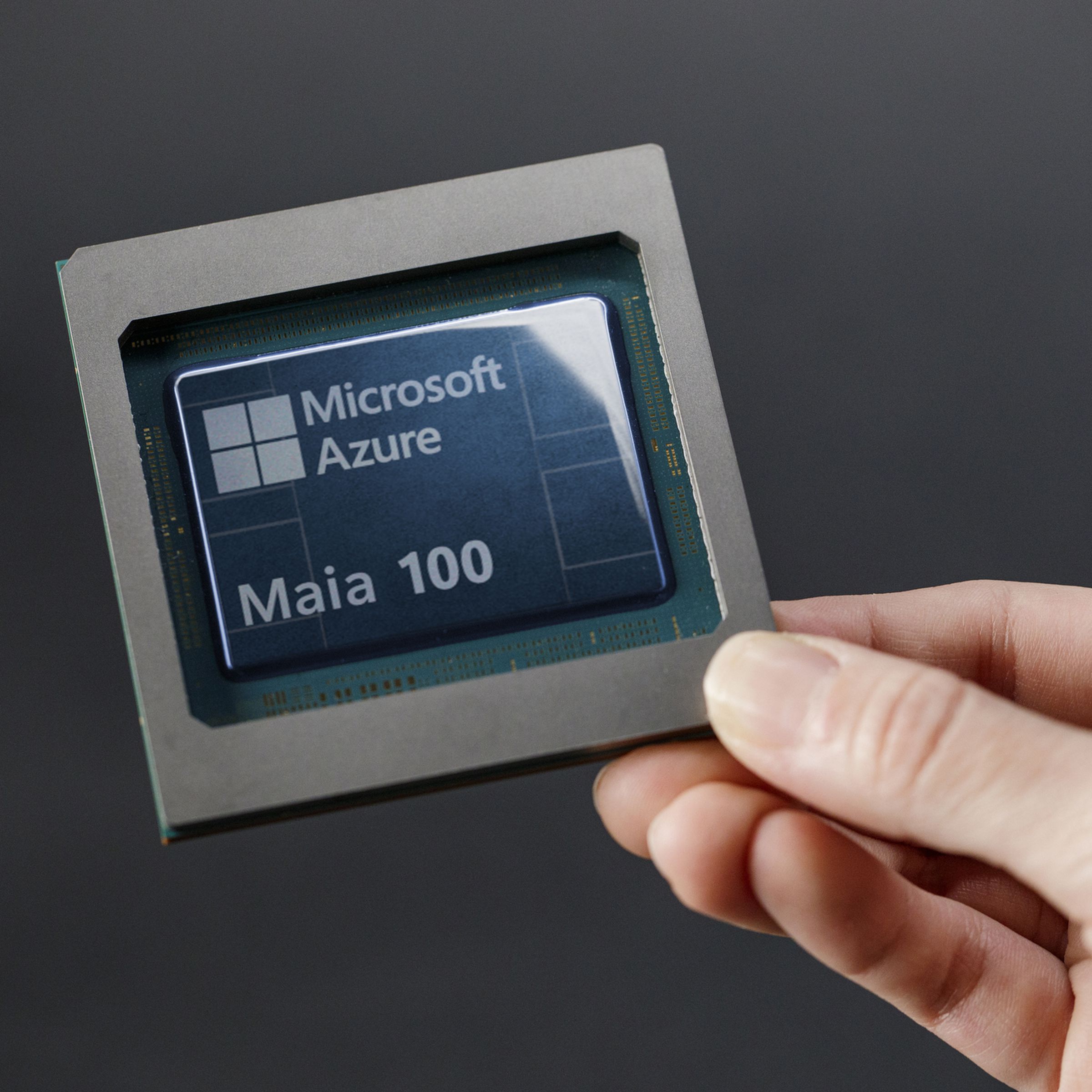 A person holding Microsoft’s Azure Maia 100 AI chip