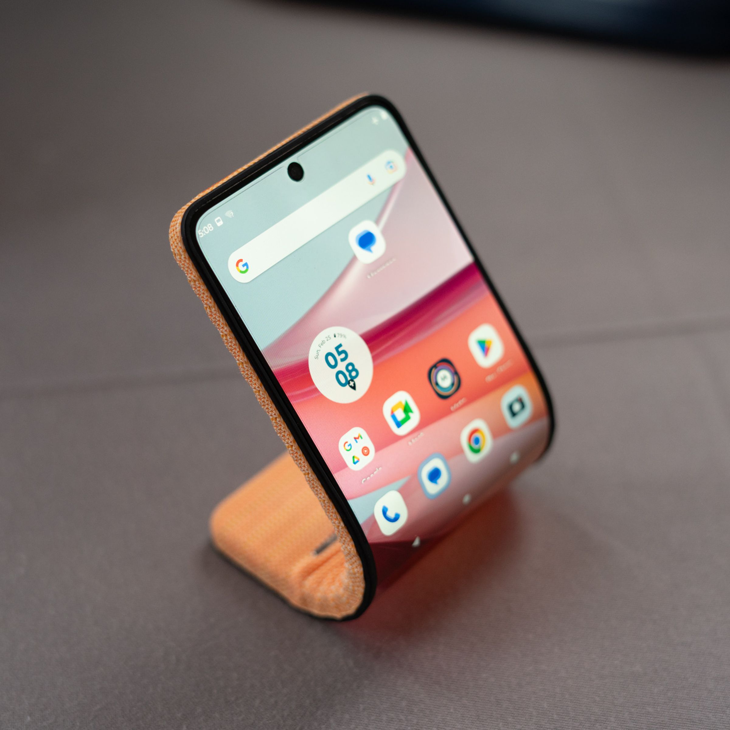 Motorola’s bending phone concept, curved and sitting on a table.