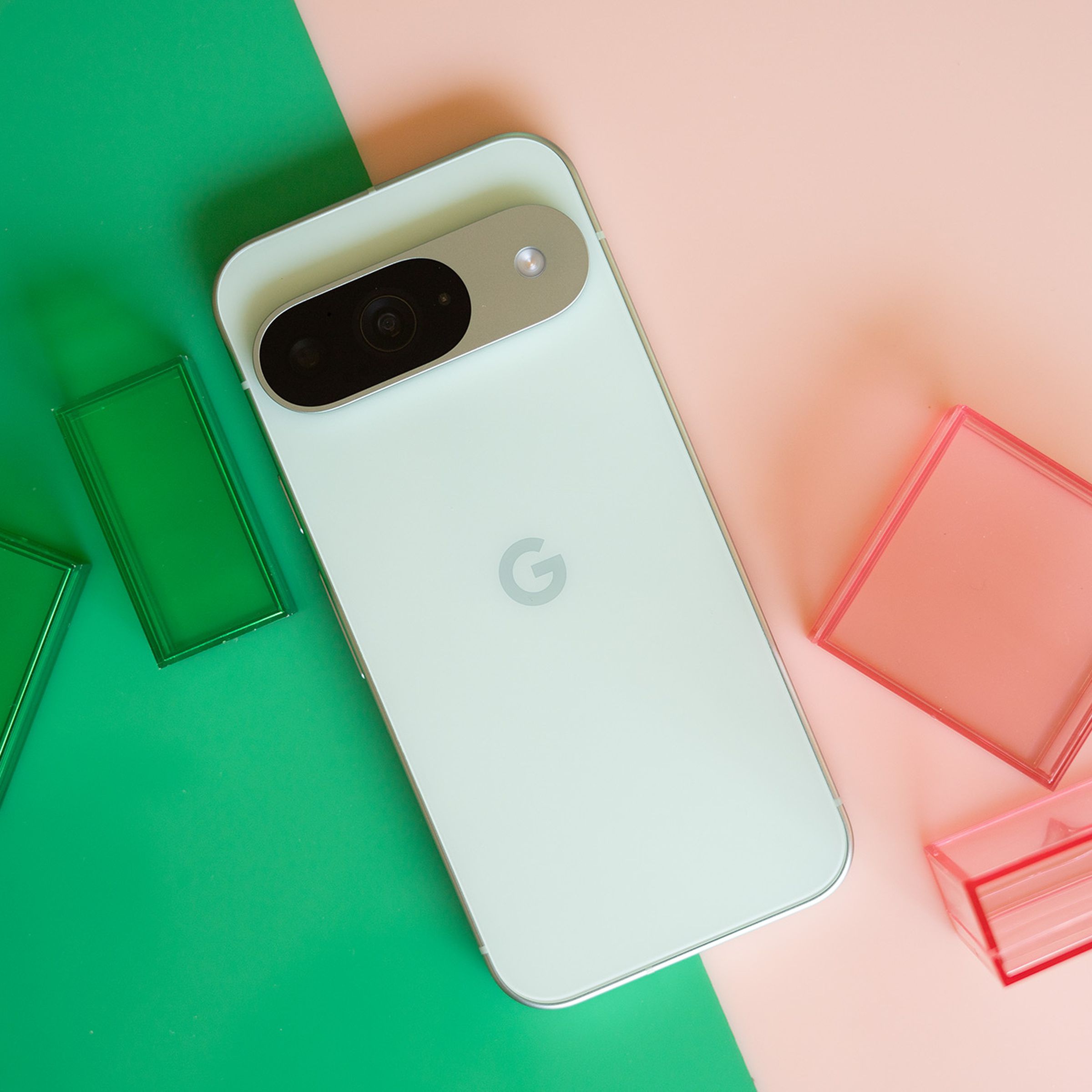 Google Pixel 9 on a pink and green background.