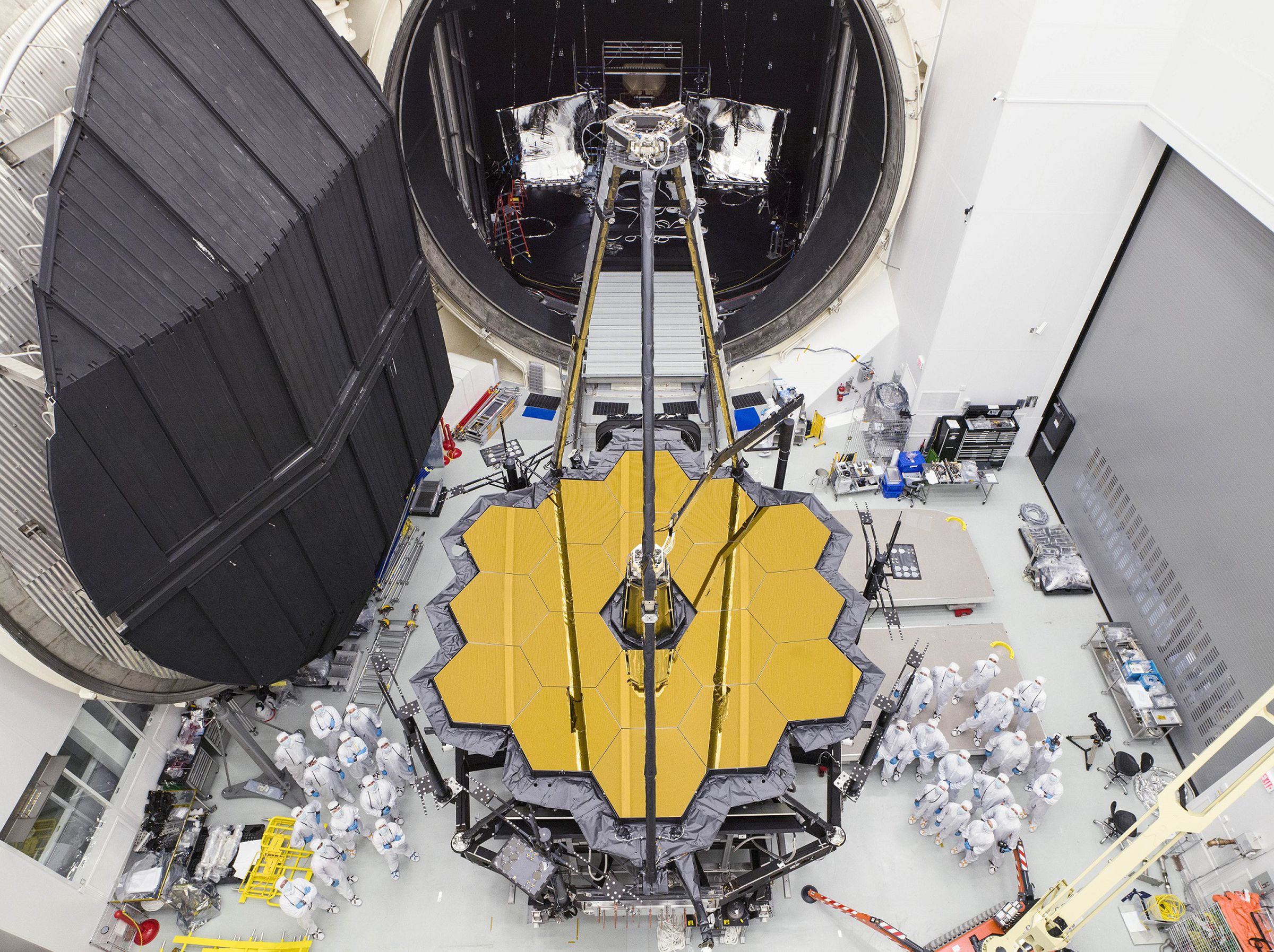 The primary mirror of JWST undergoing testing on Earth.
